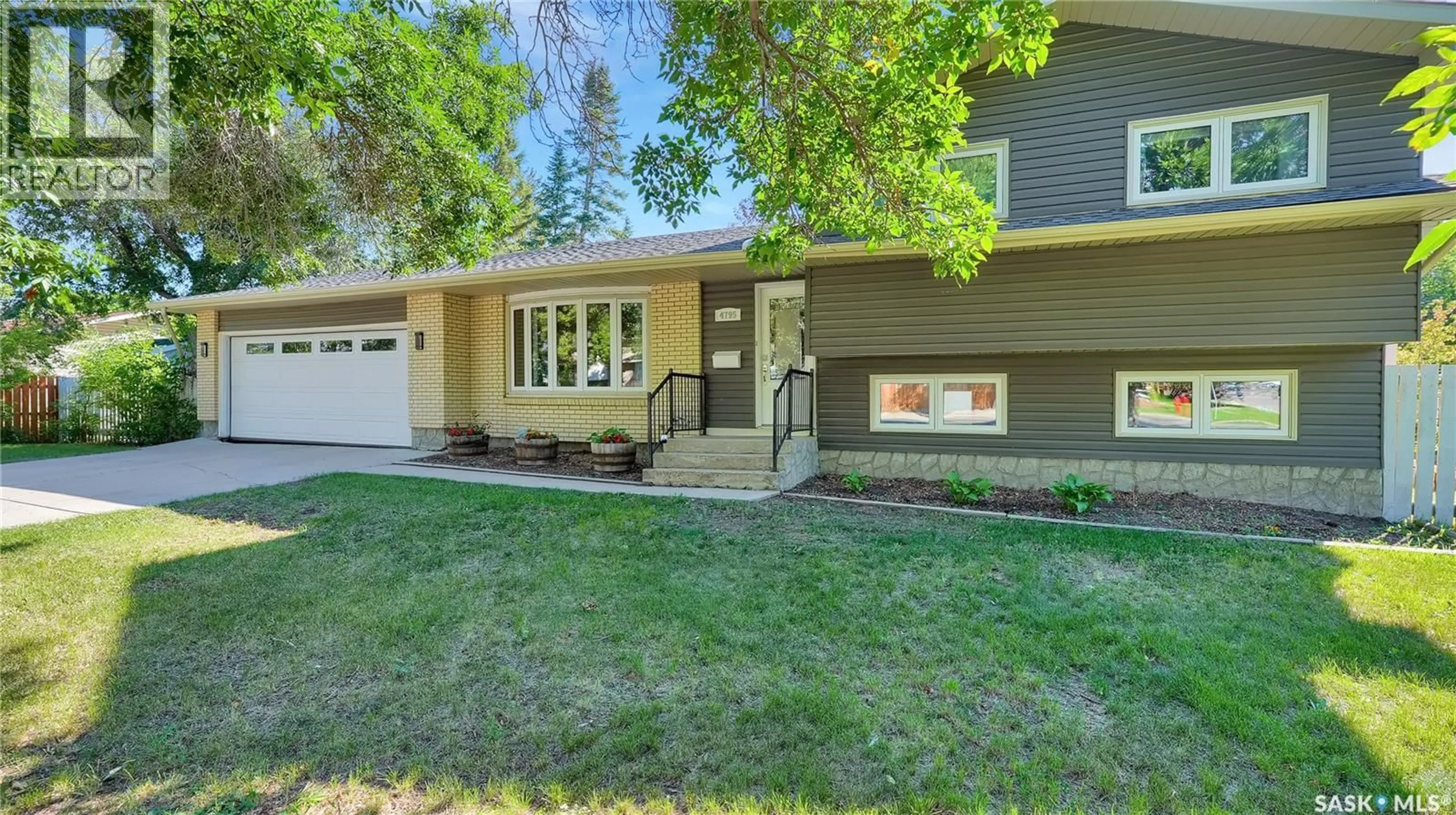 Home with vinyl exterior material, street for 4795 QUEEN STREET, Regina Saskatchewan S4S6N4