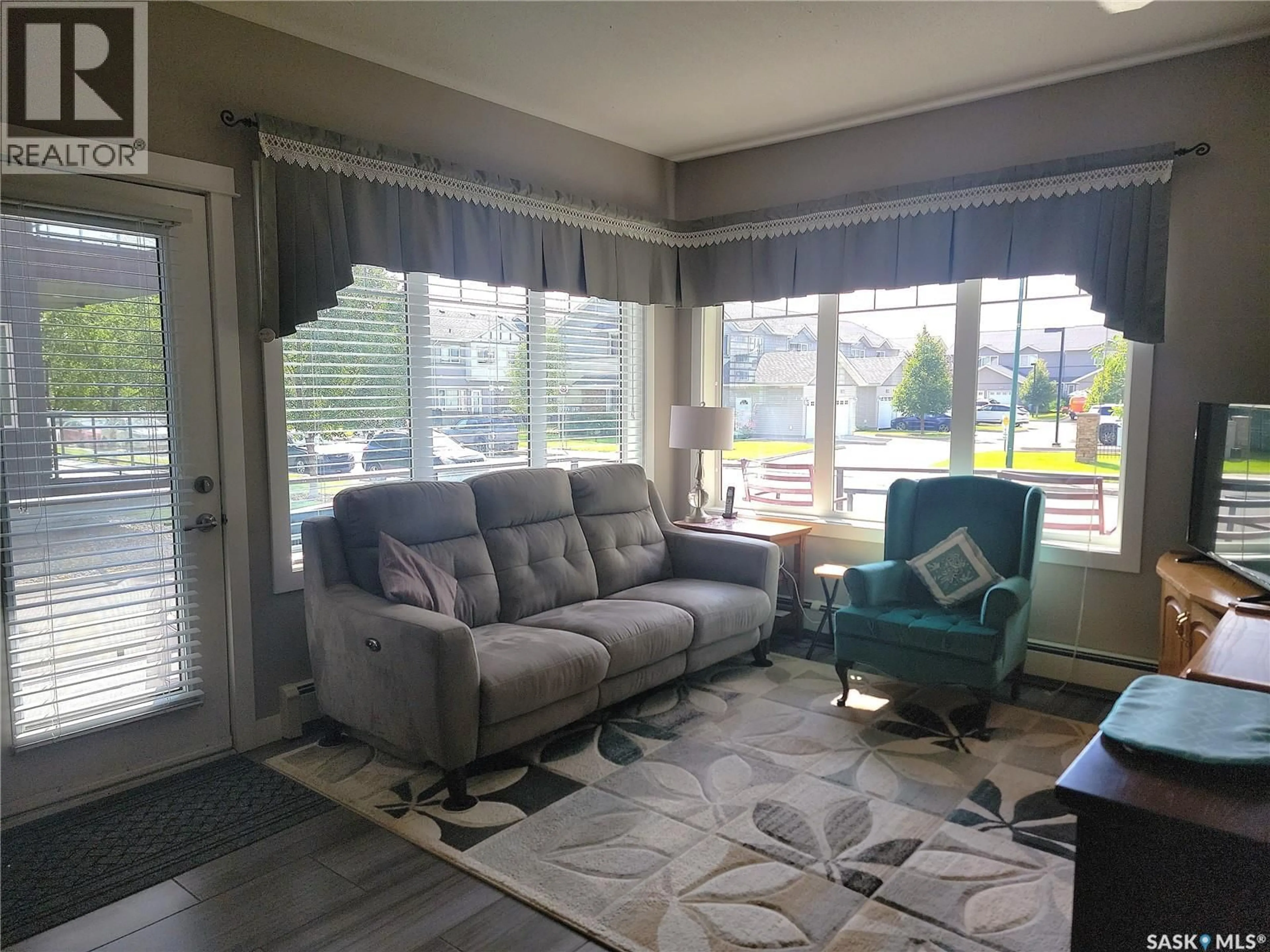 Living room with furniture, unknown for 102 - 714 HART ROAD, Saskatoon Saskatchewan S7M1L2
