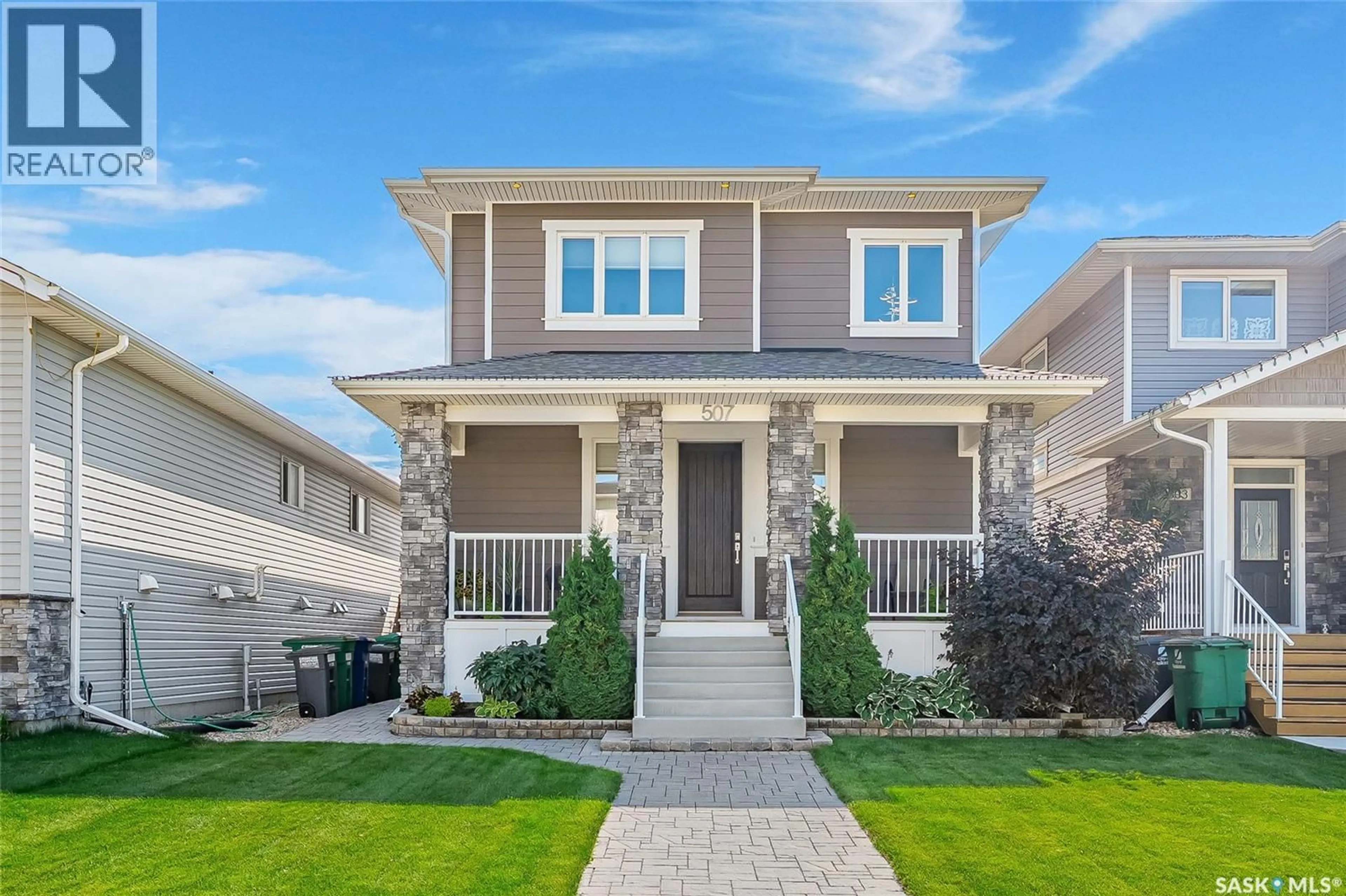 Home with vinyl exterior material, street for 507 KLOPPENBURG CRESCENT, Saskatoon Saskatchewan S7W0P1