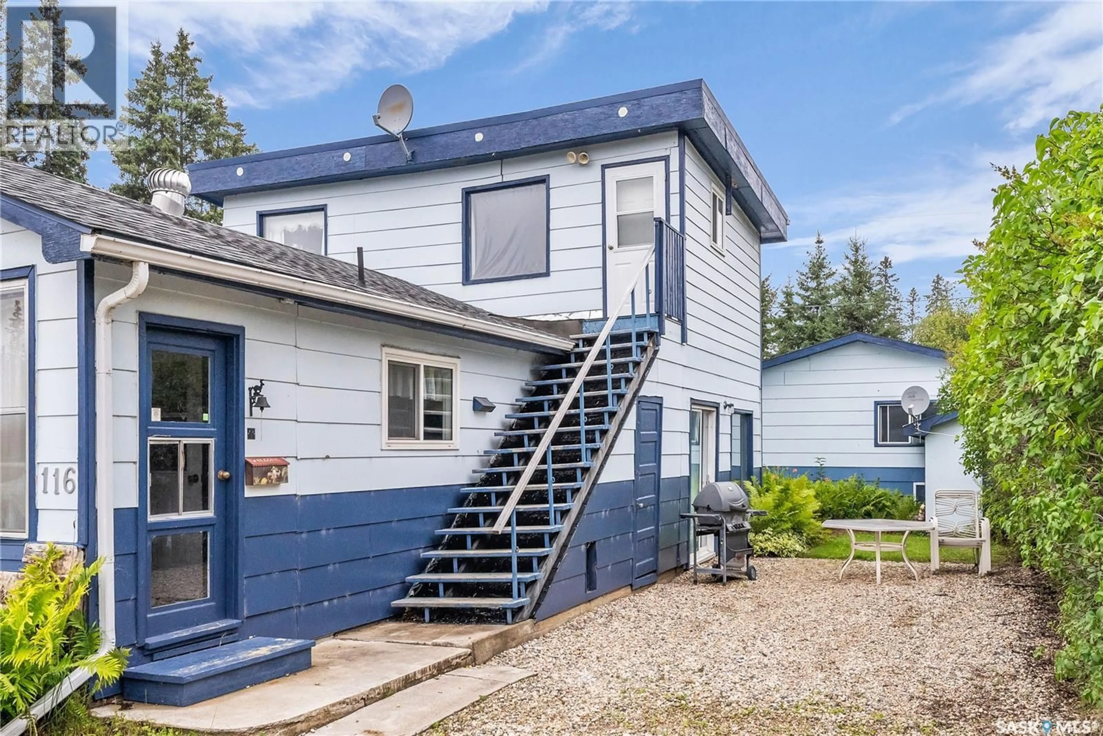 Home with vinyl exterior material, street for 116 FOSTER STREET, Lakeland Rm No. 521 Saskatchewan S0J0N0