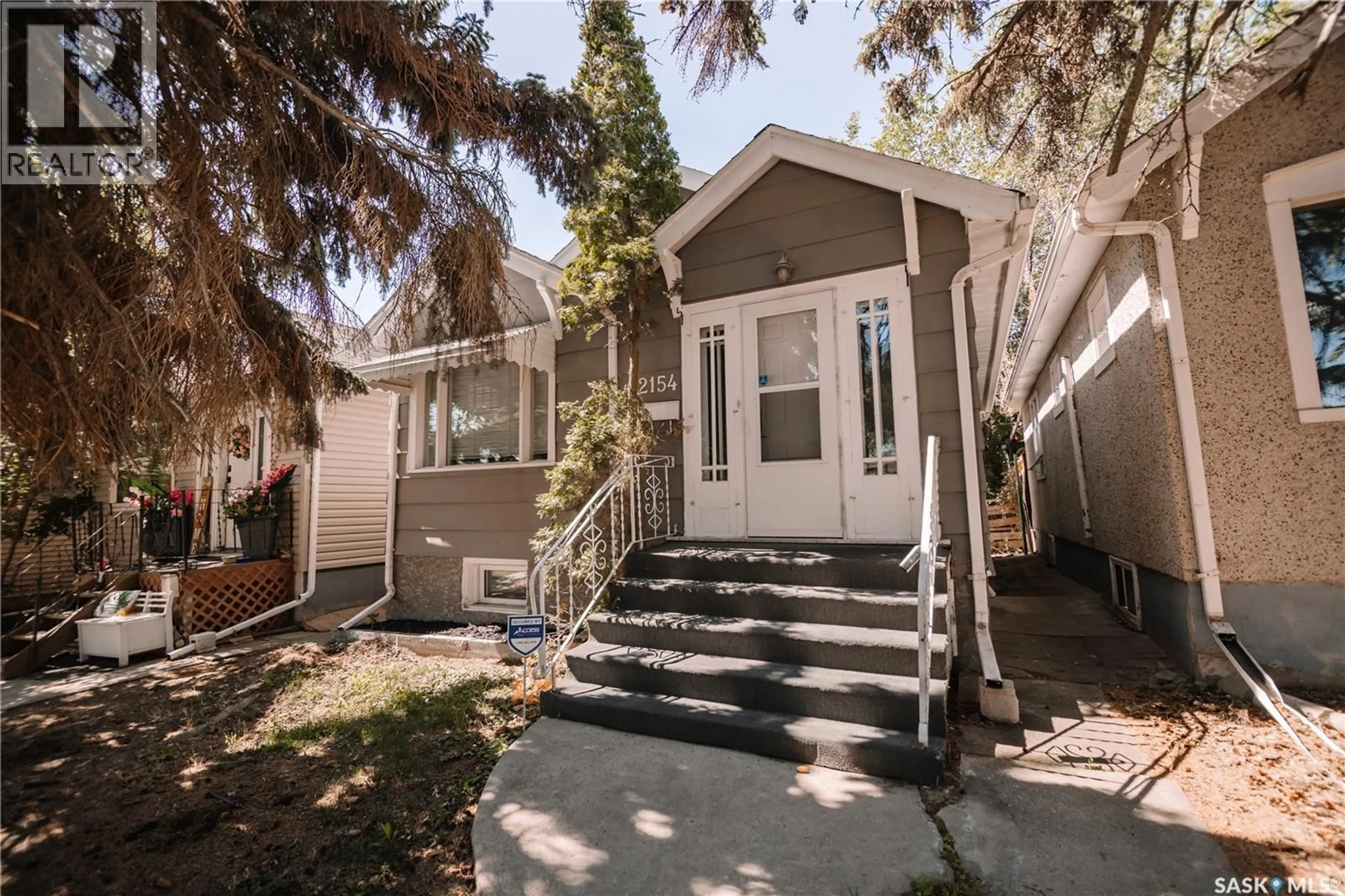 Home with vinyl exterior material, street for 2154 BRODER STREET, Regina Saskatchewan S4N3S4