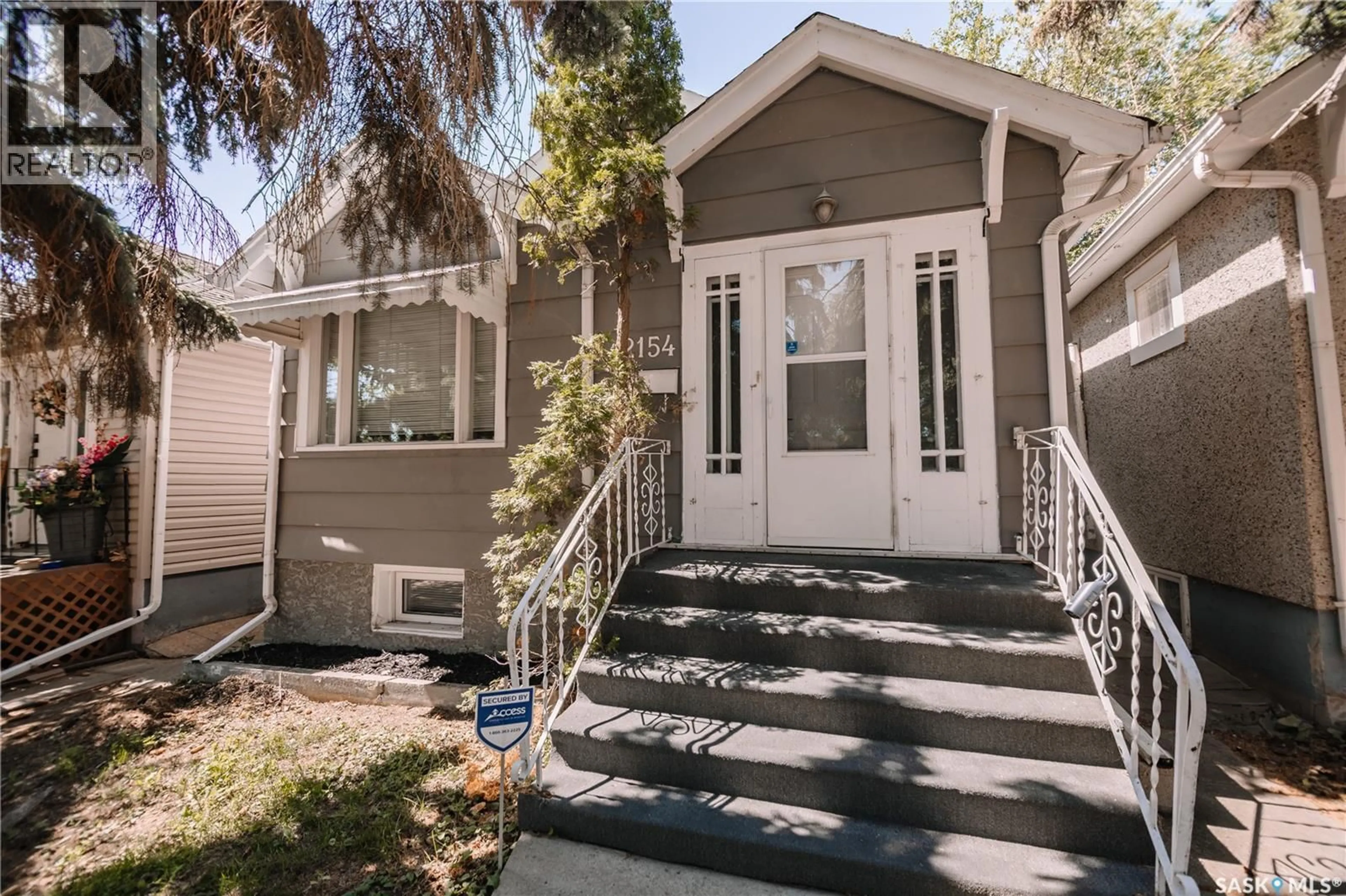 Home with vinyl exterior material, street for 2154 BRODER STREET, Regina Saskatchewan S4N3S4