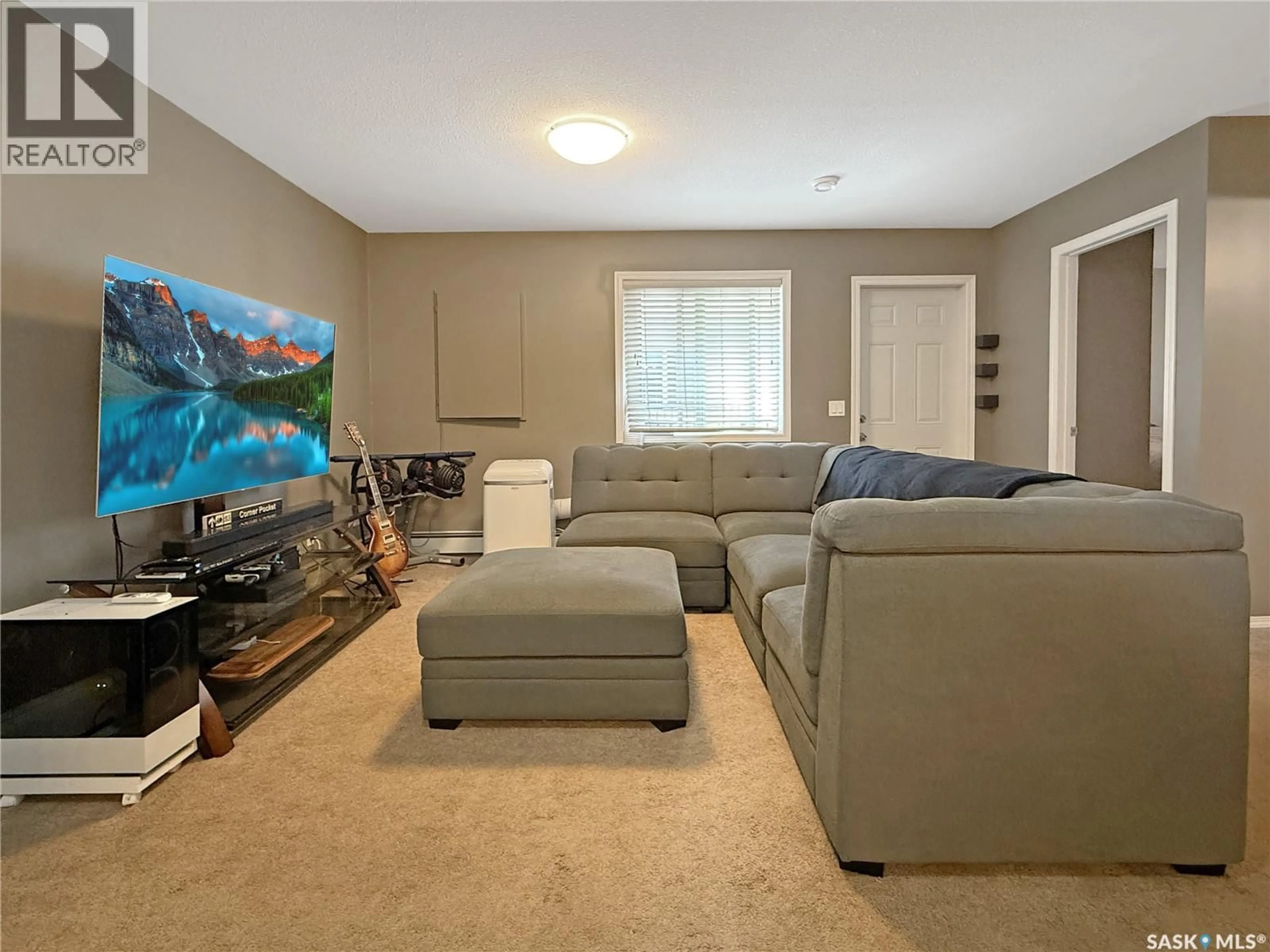 Living room with furniture, unknown for 214 825 GLADSTONE STREET E, Swift Current Saskatchewan S9H5P1
