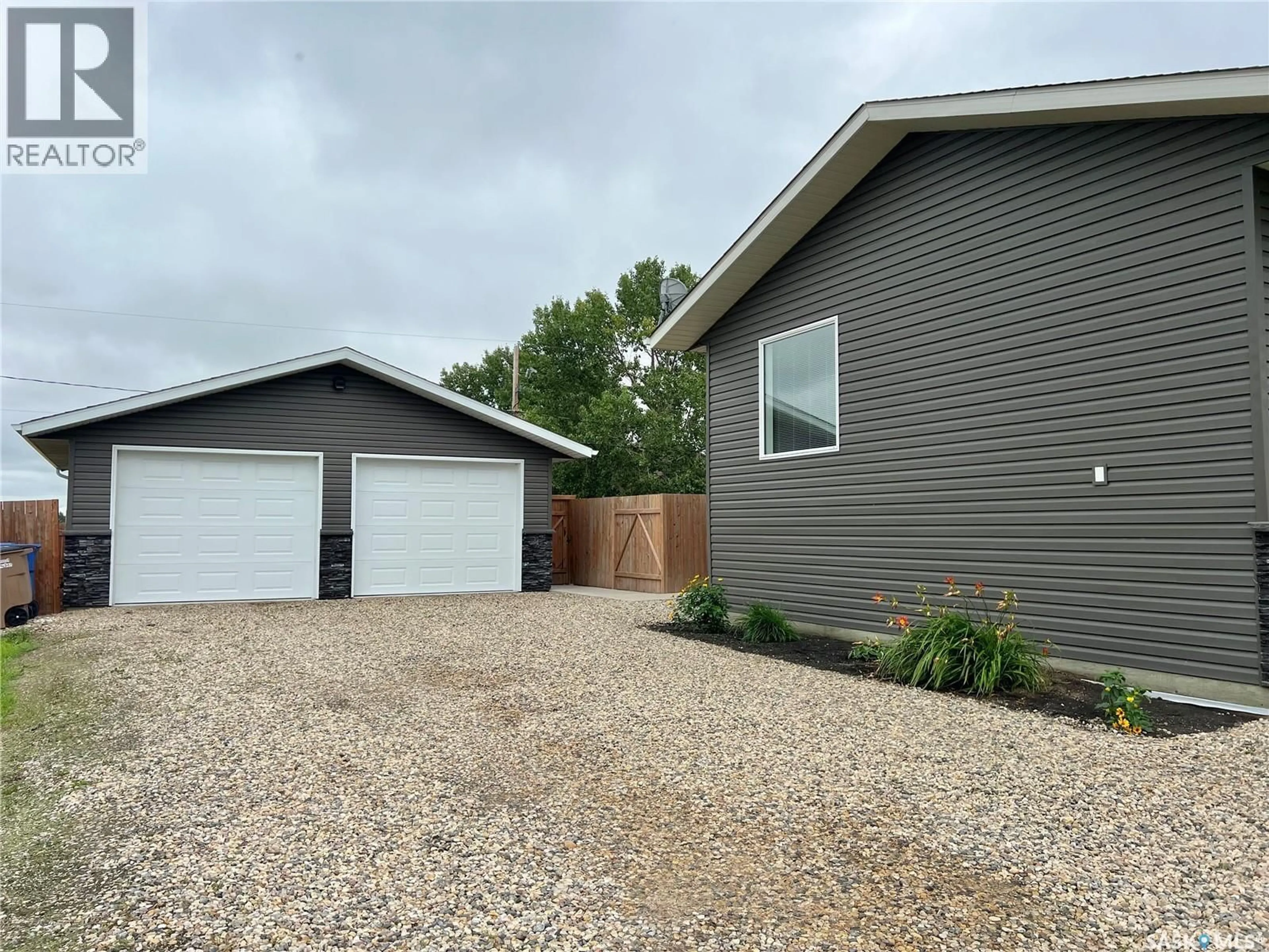 Home with vinyl exterior material, street for 1508 MAIN STREET, Melfort Saskatchewan S0E1A0