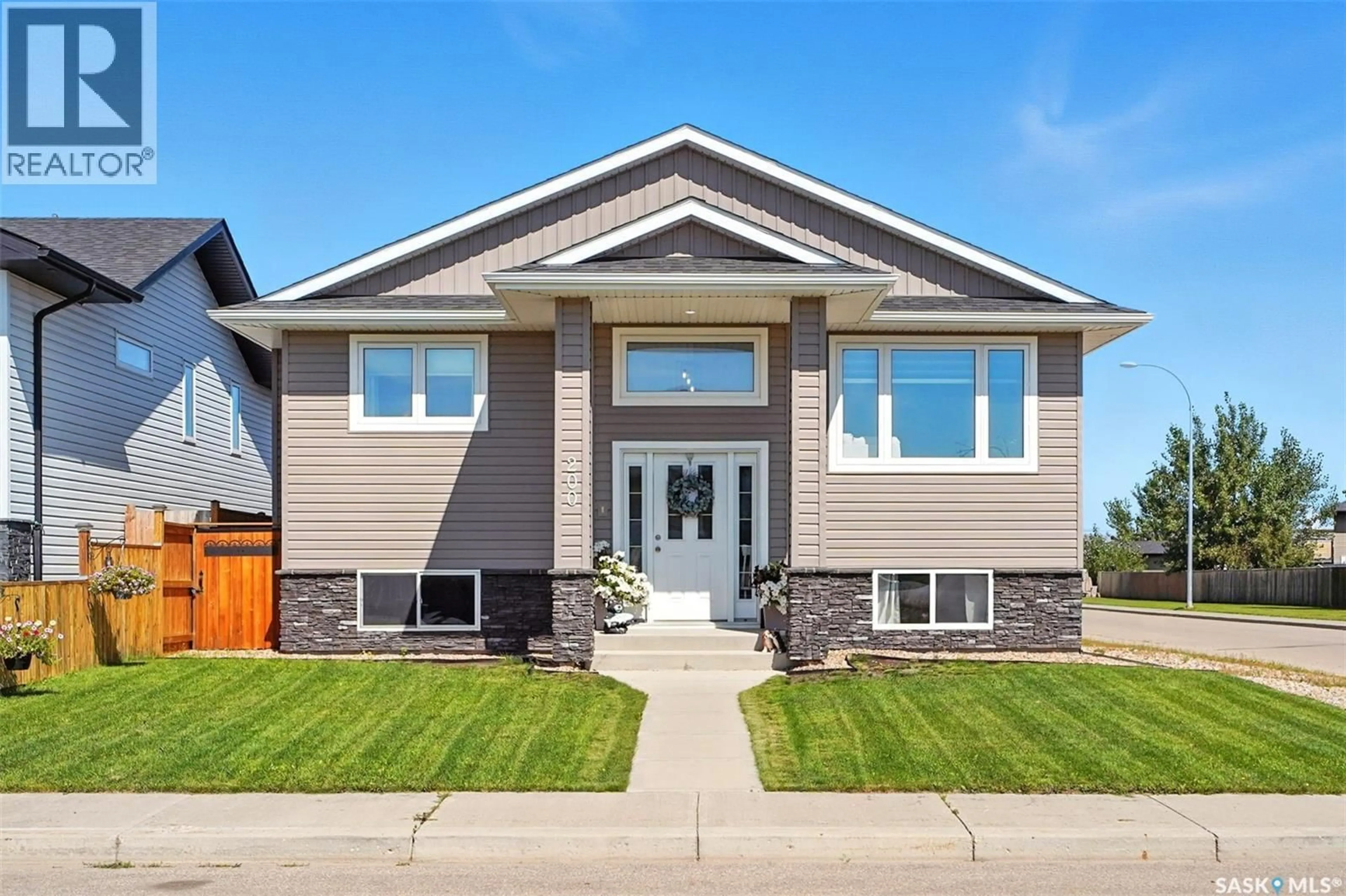 Home with vinyl exterior material, street for 200 REDDEKOPP LANE, Warman Saskatchewan S0K4S3
