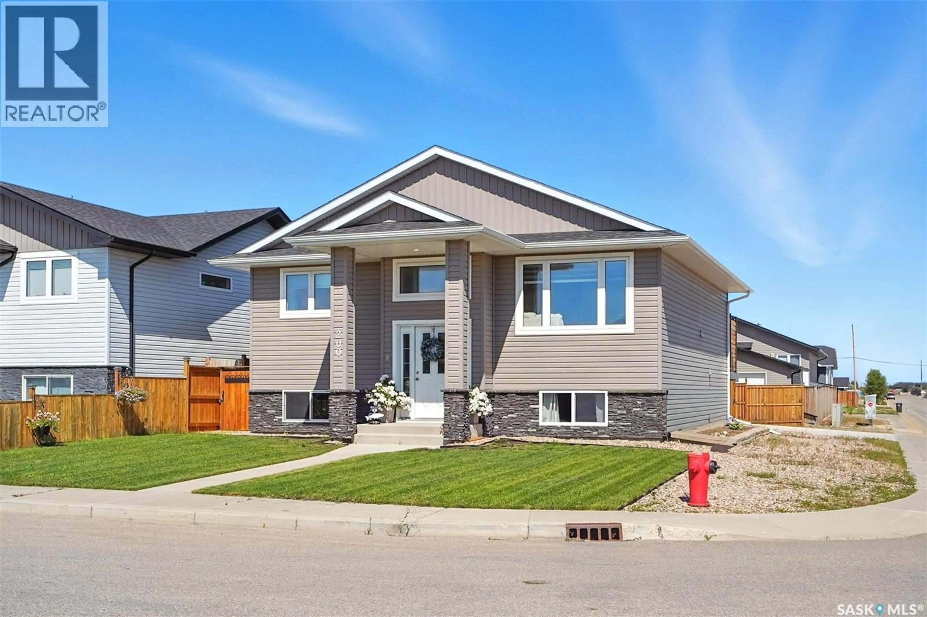 Home with vinyl exterior material, street for 200 REDDEKOPP LANE, Warman Saskatchewan S0K4S3