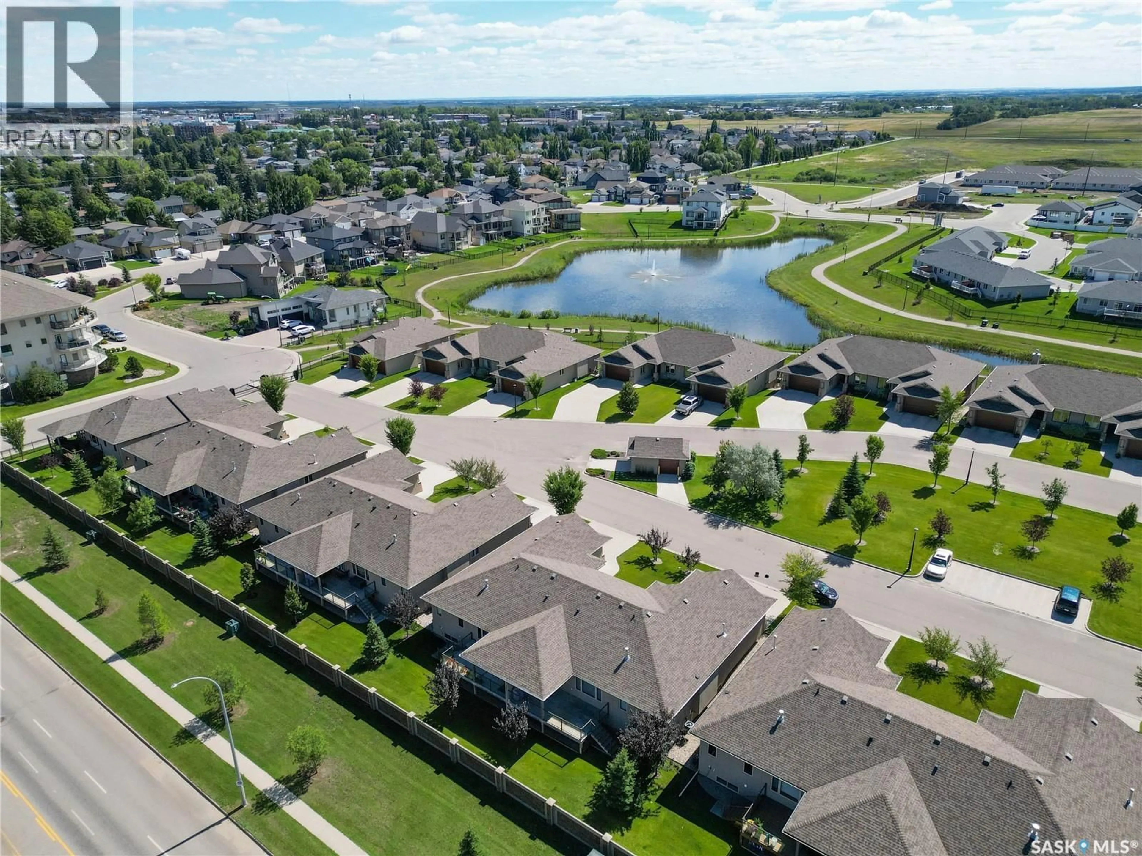 A pic from outside/outdoor area/front of a property/back of a property/a pic from drone, water/lake/river/ocean view for 20 - 2805 LAKEVIEW DRIVE, Prince Albert Saskatchewan S6W0A4