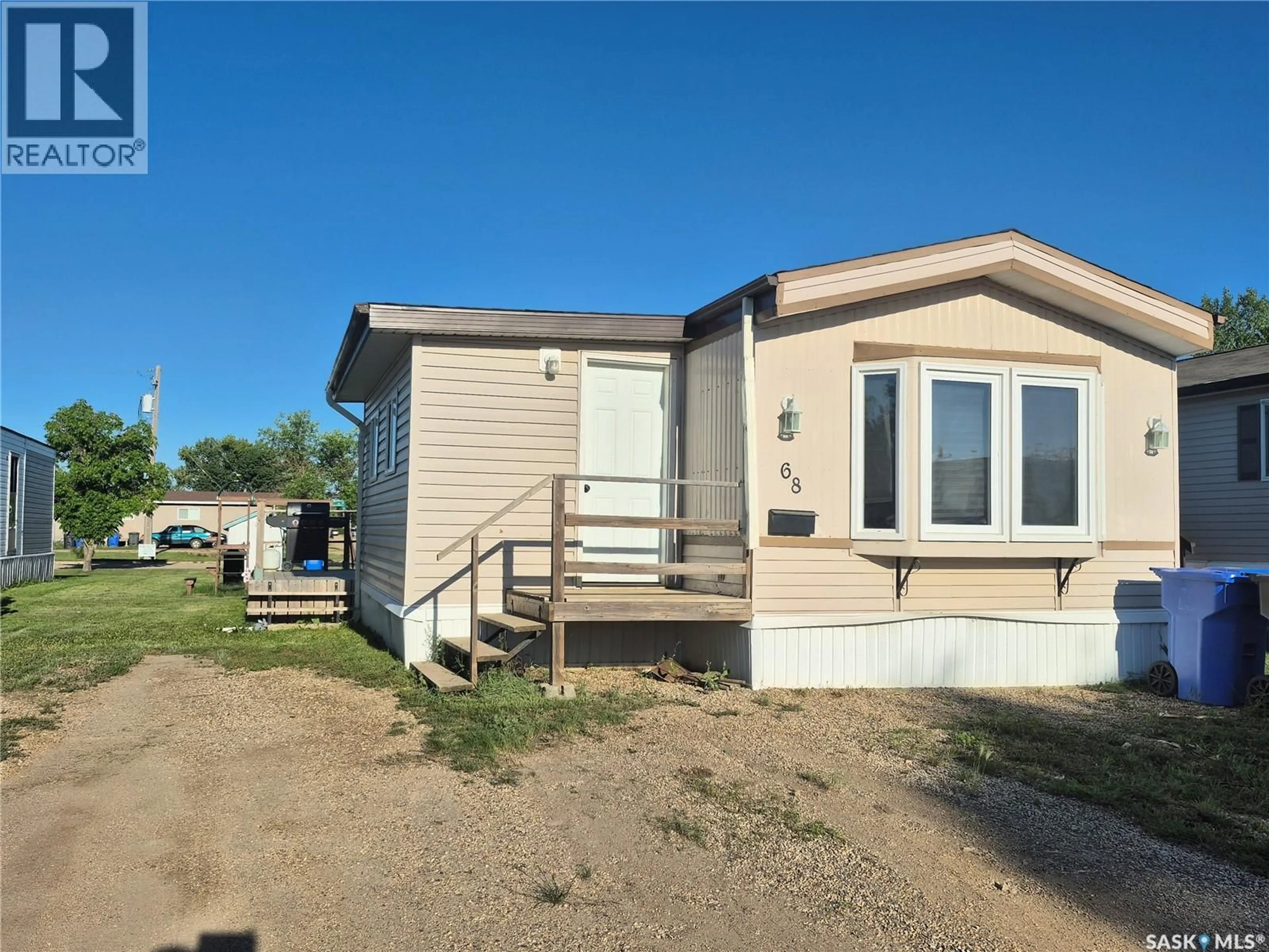 Home with vinyl exterior material, street for SW - 68 106 1ST AVENUE, Weyburn Saskatchewan S4H2J1