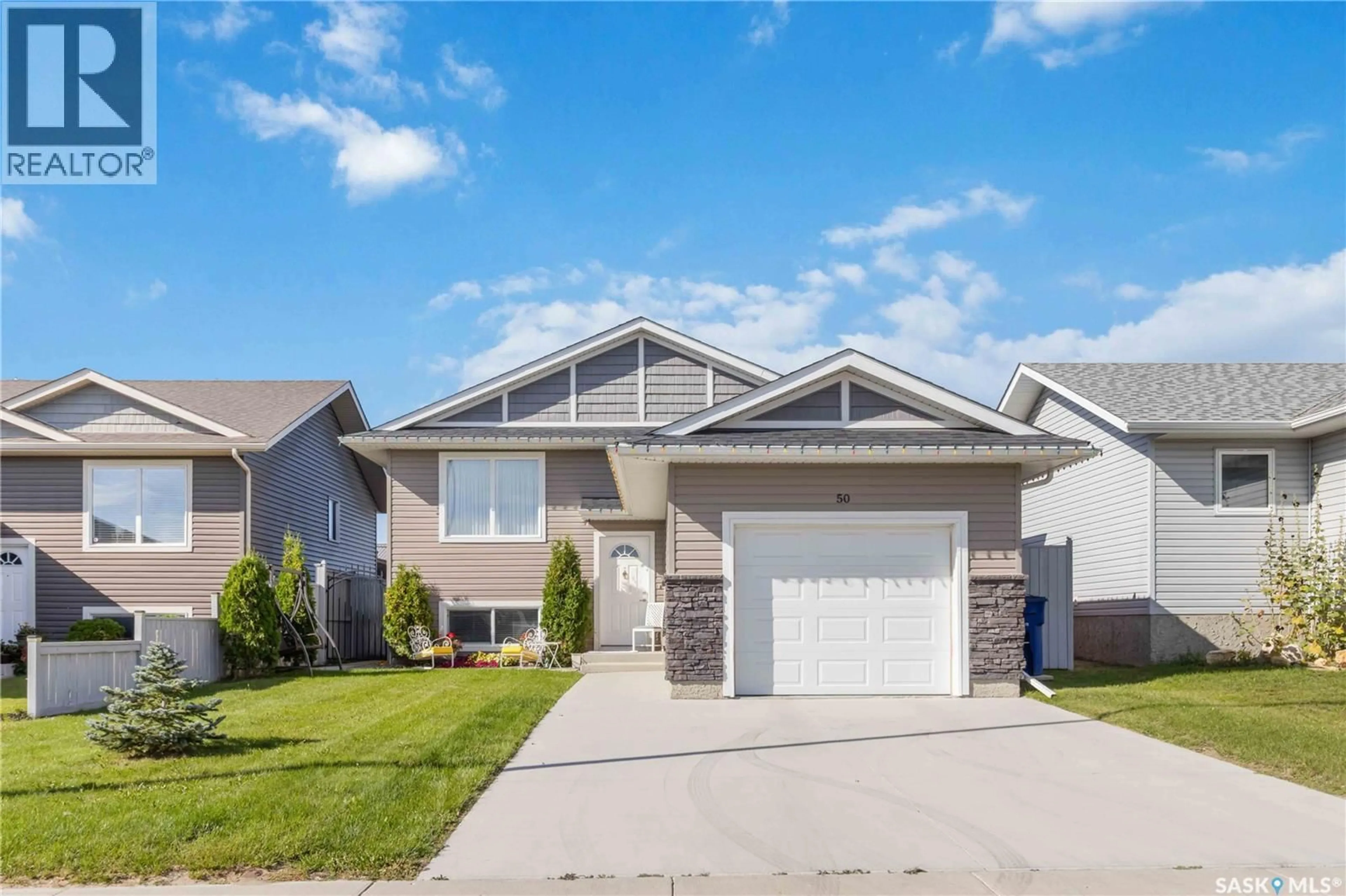 Home with vinyl exterior material, street for 50 MARTENS CRESCENT, Warman Saskatchewan S0K4S0