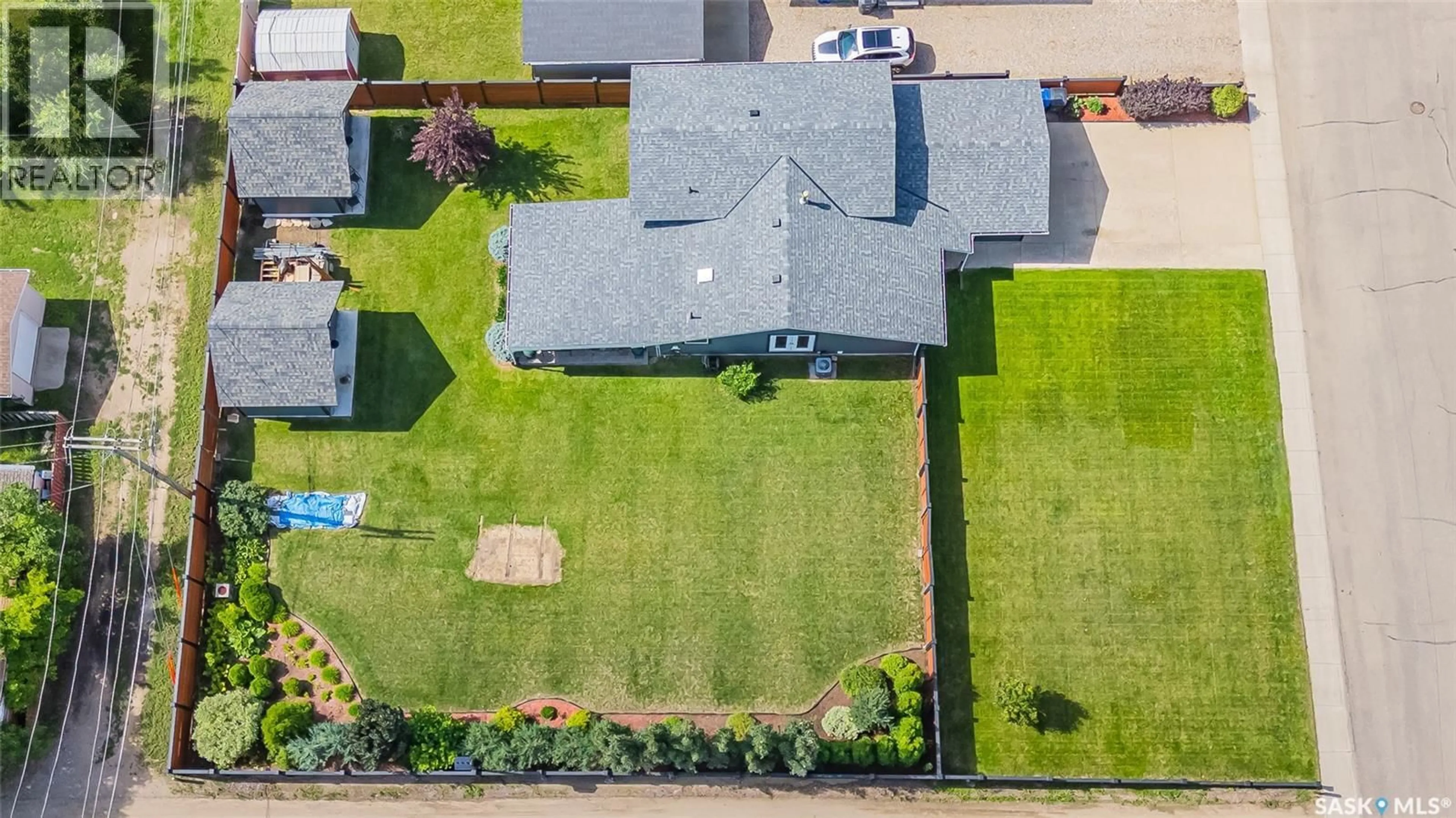 A pic from outside/outdoor area/front of a property/back of a property/a pic from drone, street for 104 8TH AVENUE, Biggar Saskatchewan S0K0M0