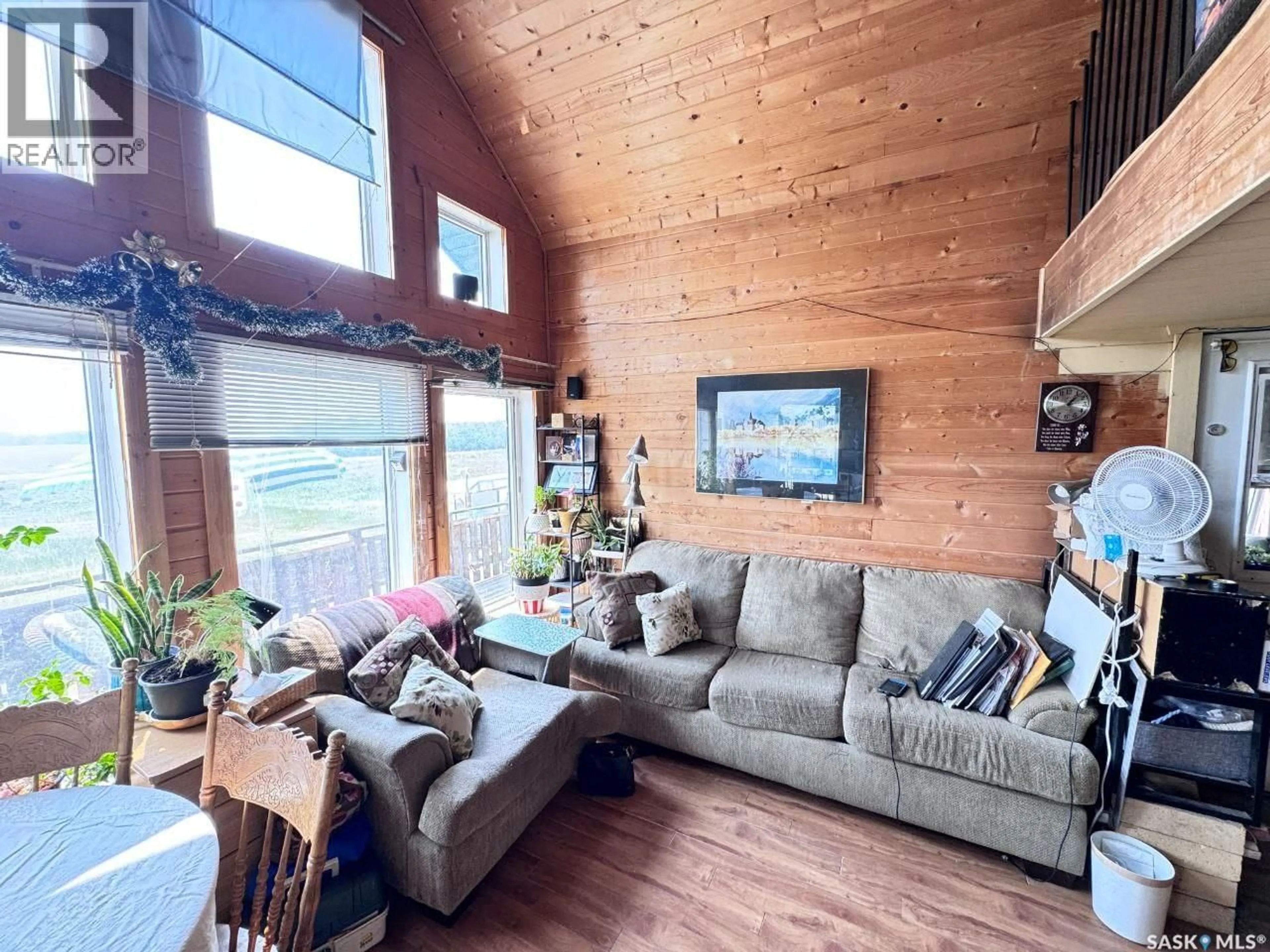 Living room with furniture, wood/laminate floor for BLAINE LAKE, Blaine Lake Rm No. 434 Saskatchewan S0J1R0