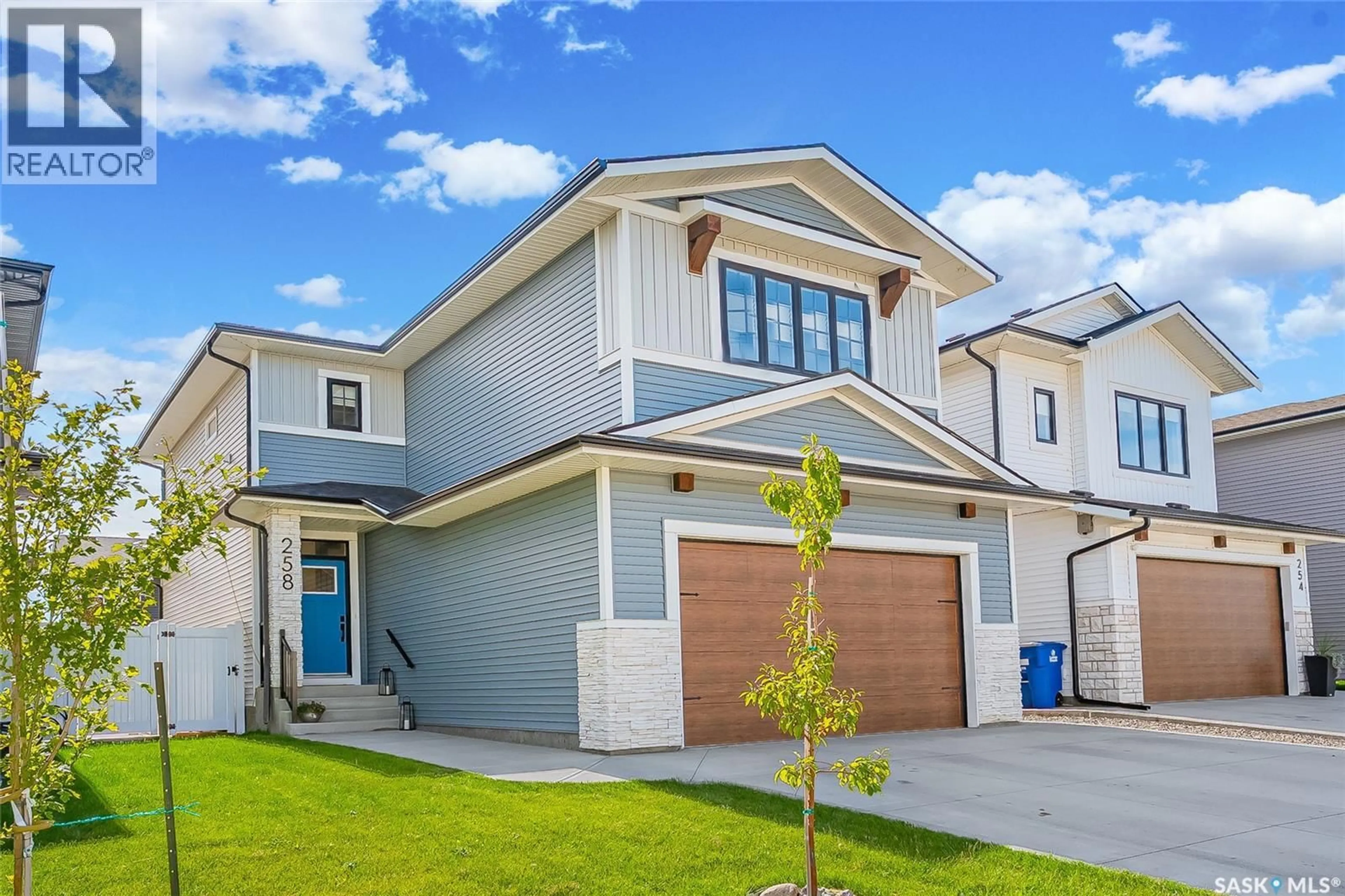 Home with vinyl exterior material, street for 258 PRASAD MANOR, Saskatoon Saskatchewan S7V1L4