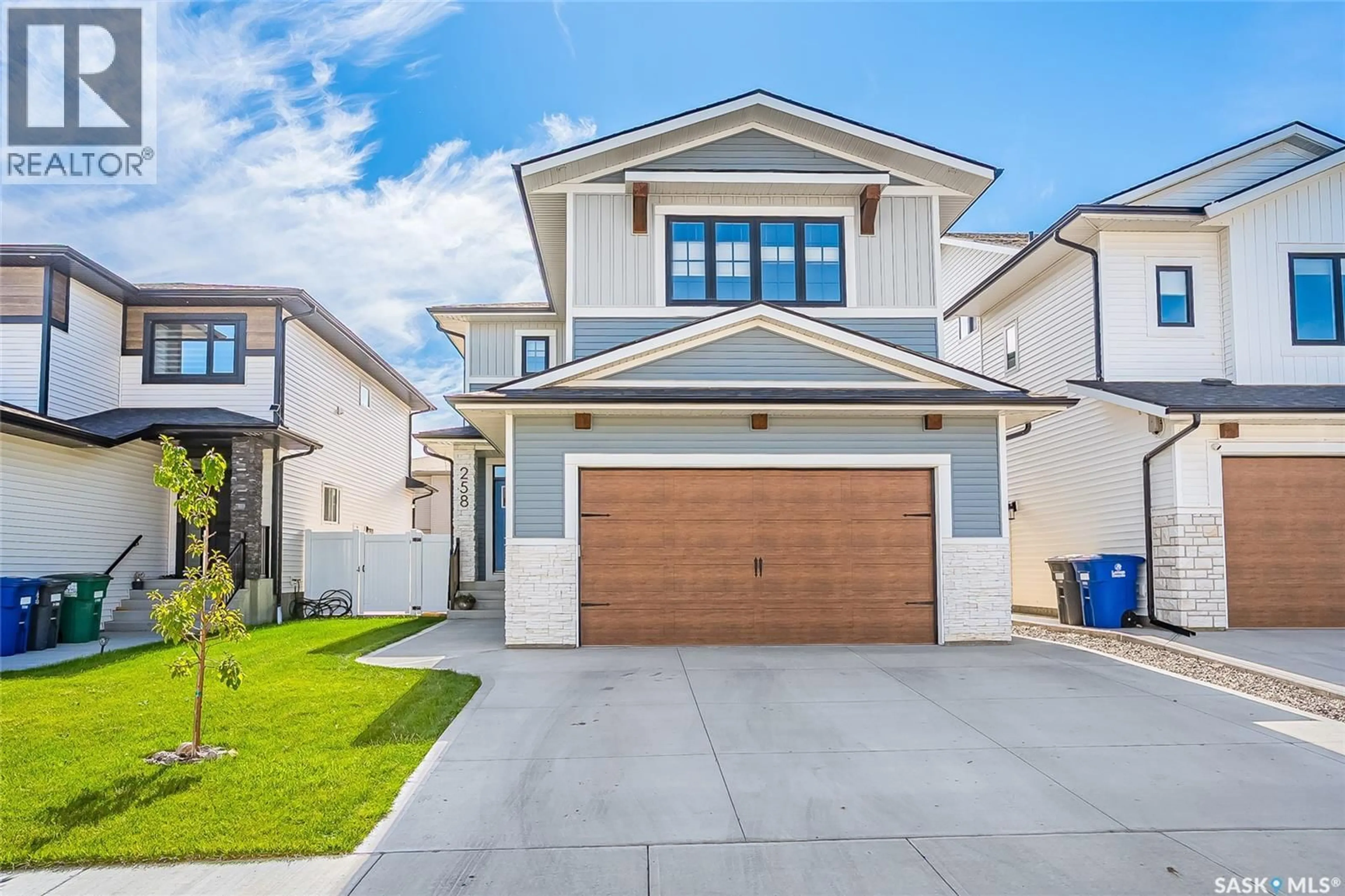 Home with vinyl exterior material, street for 258 PRASAD MANOR, Saskatoon Saskatchewan S7V1L4