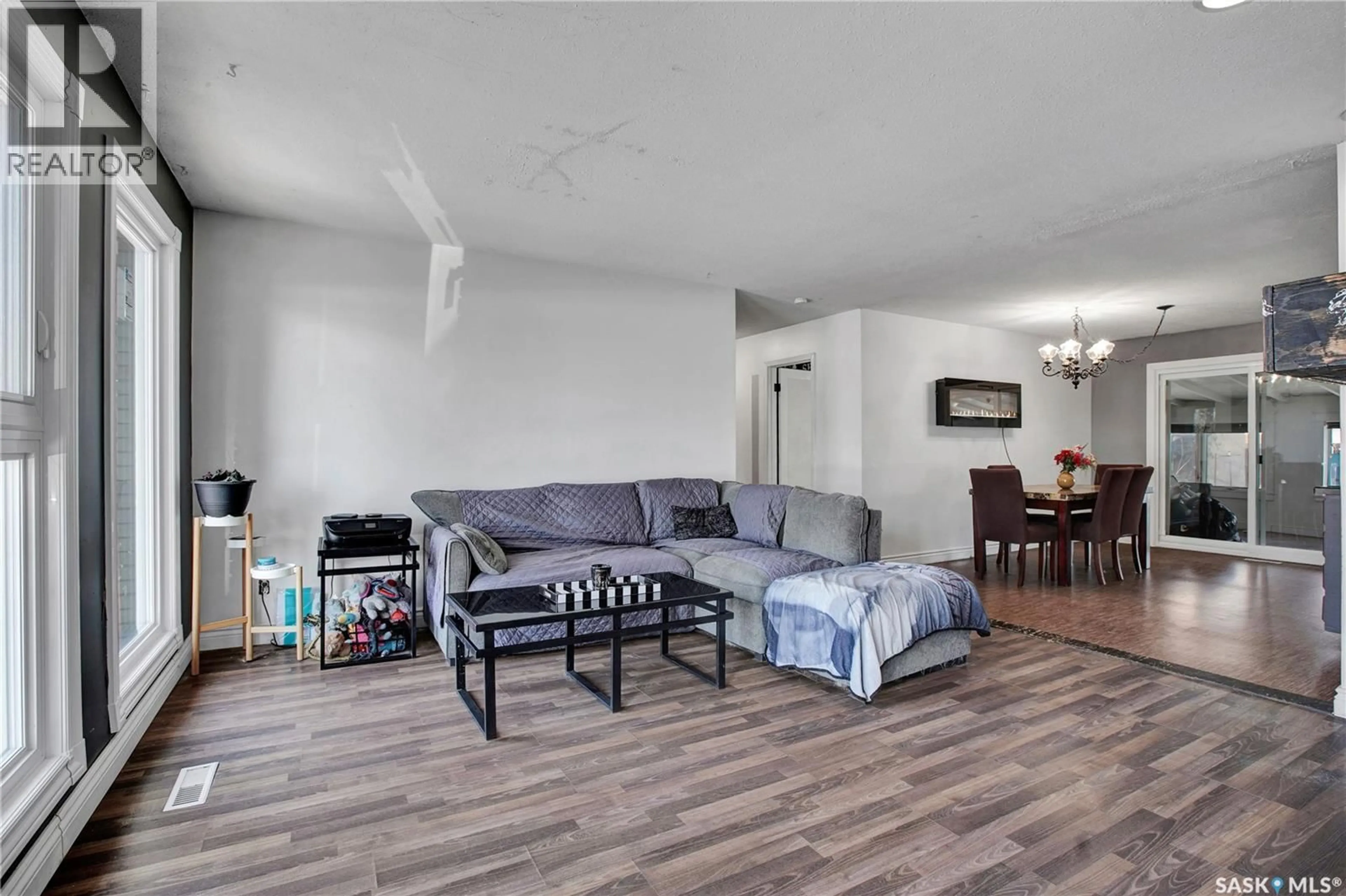 Living room with furniture, wood/laminate floor for N W - 118 RAILWAY STREET, Warman Saskatchewan S0K4S0