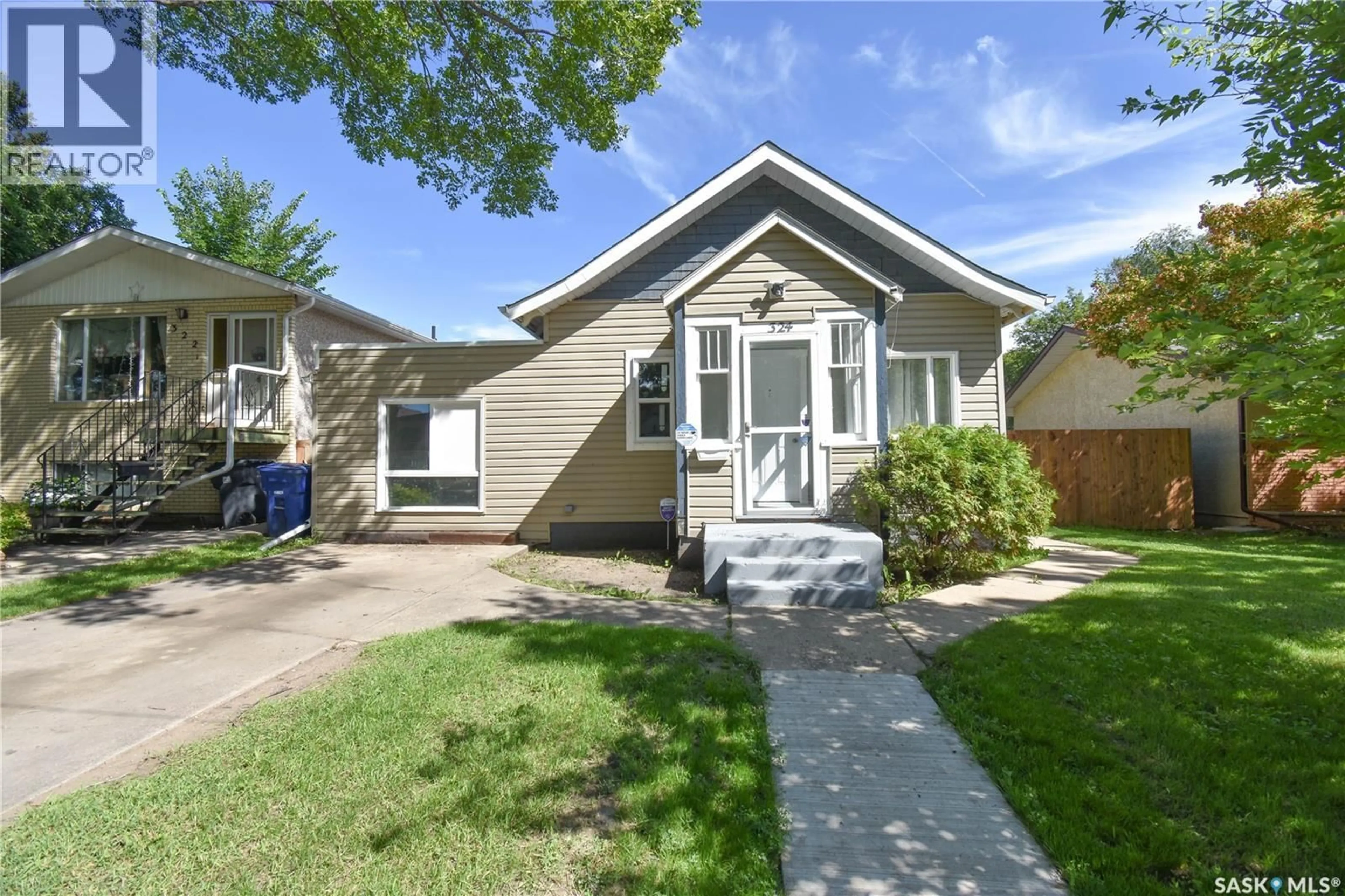 Home with vinyl exterior material, street for 324 U AVENUE, Saskatoon Saskatchewan S7M3C3