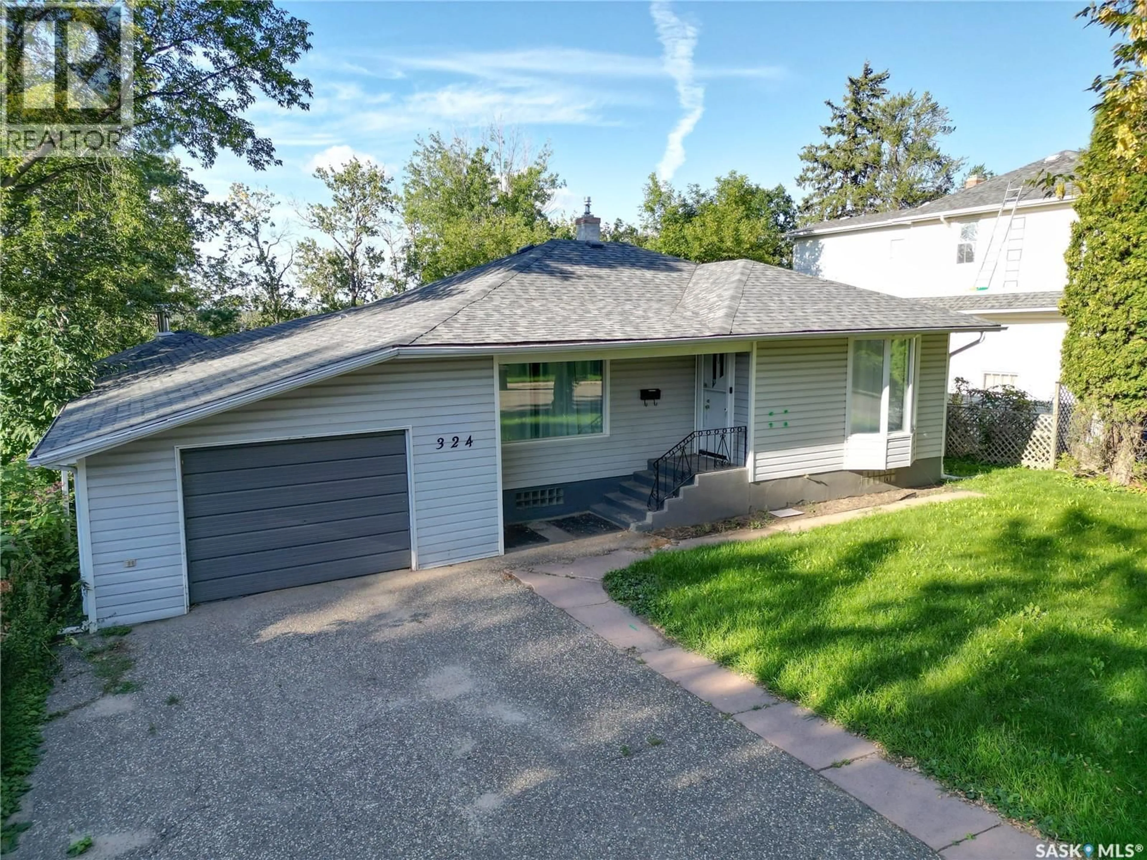 Home with vinyl exterior material, street for 324 19TH STREET, Prince Albert Saskatchewan S6V4C7