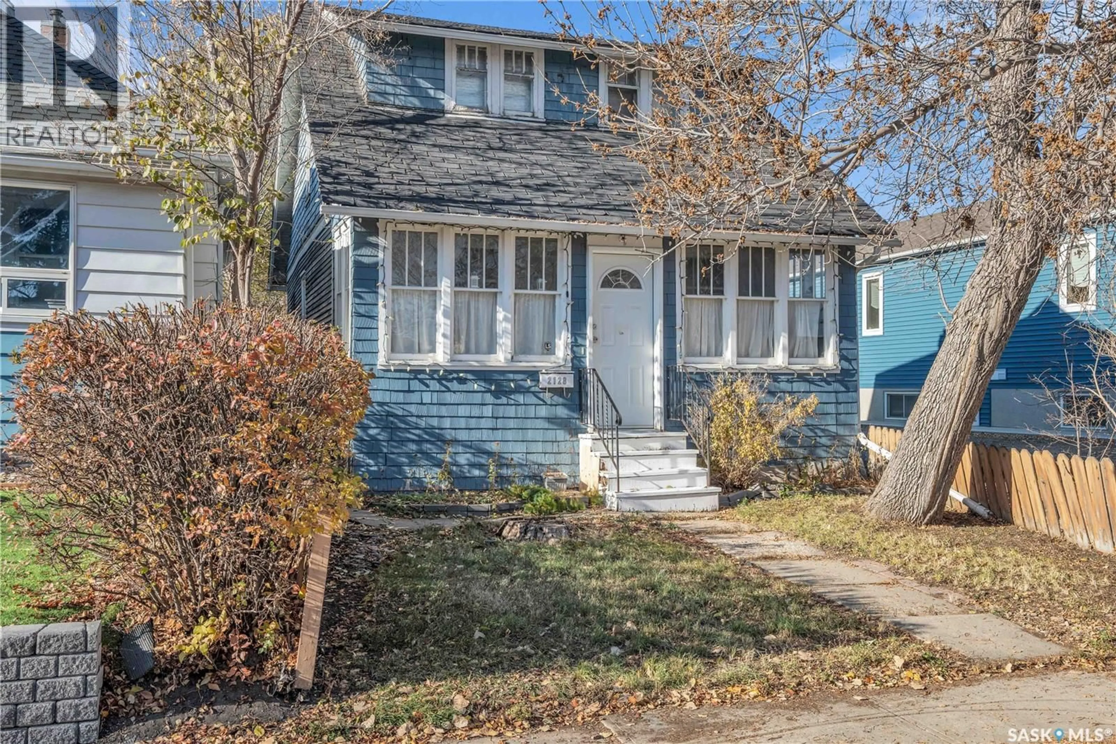 Home with vinyl exterior material, street for 2128 REYNOLDS STREET, Regina Saskatchewan S4N3N1