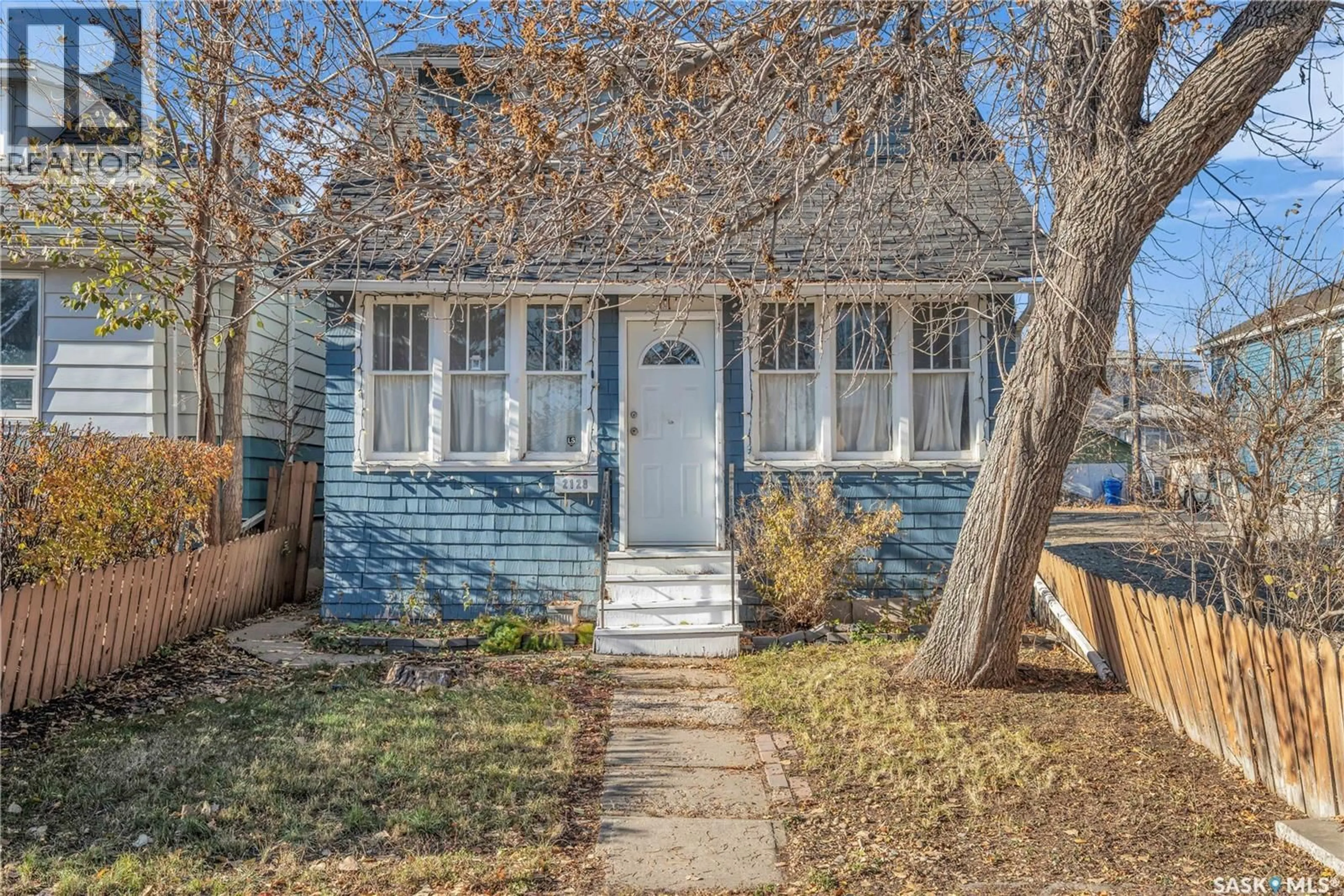 Home with vinyl exterior material, street for 2128 REYNOLDS STREET, Regina Saskatchewan S4N3N1