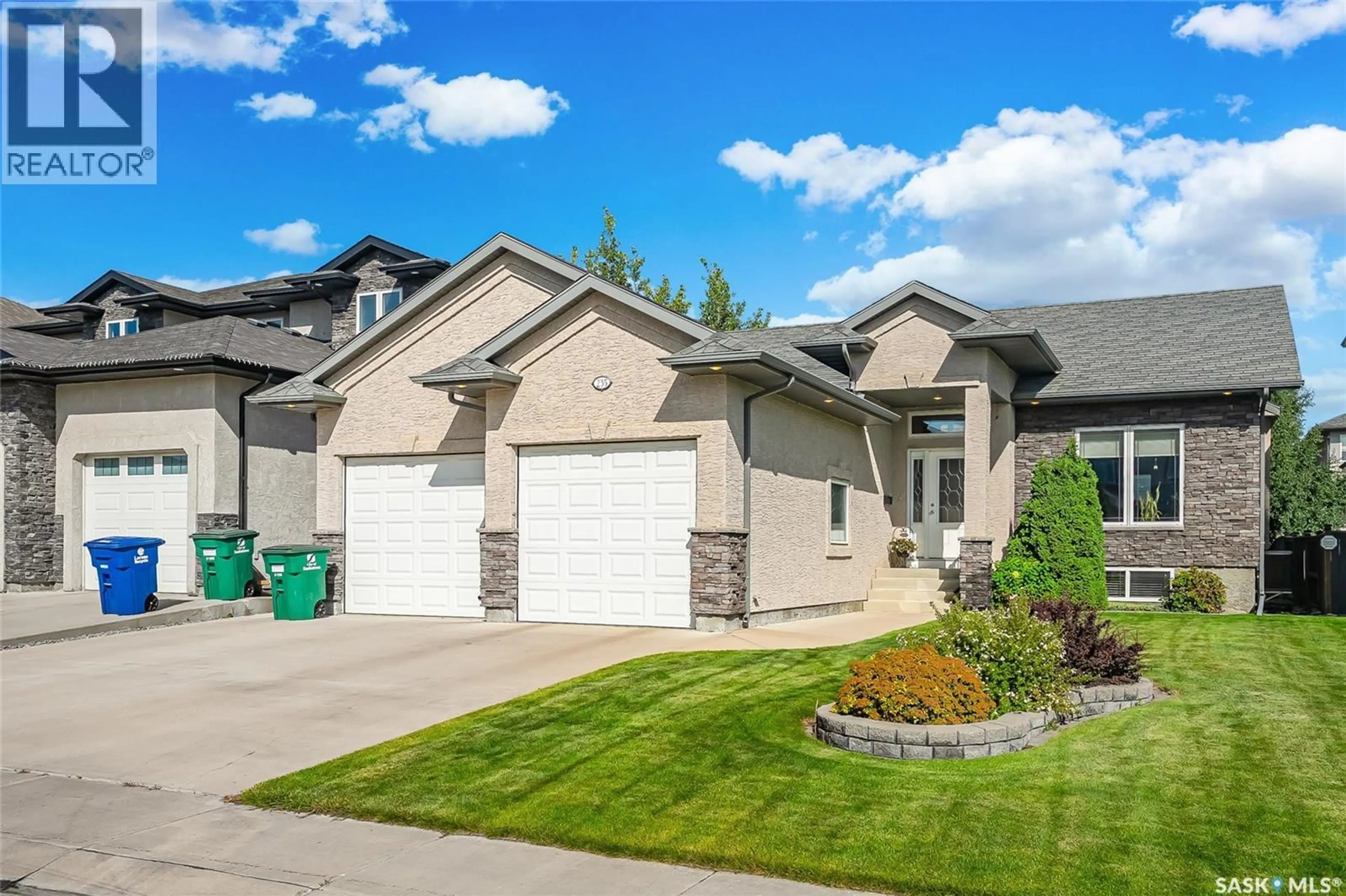 Home with vinyl exterior material, street for 235 WATERS LANE, Saskatoon Saskatchewan S7W0A6