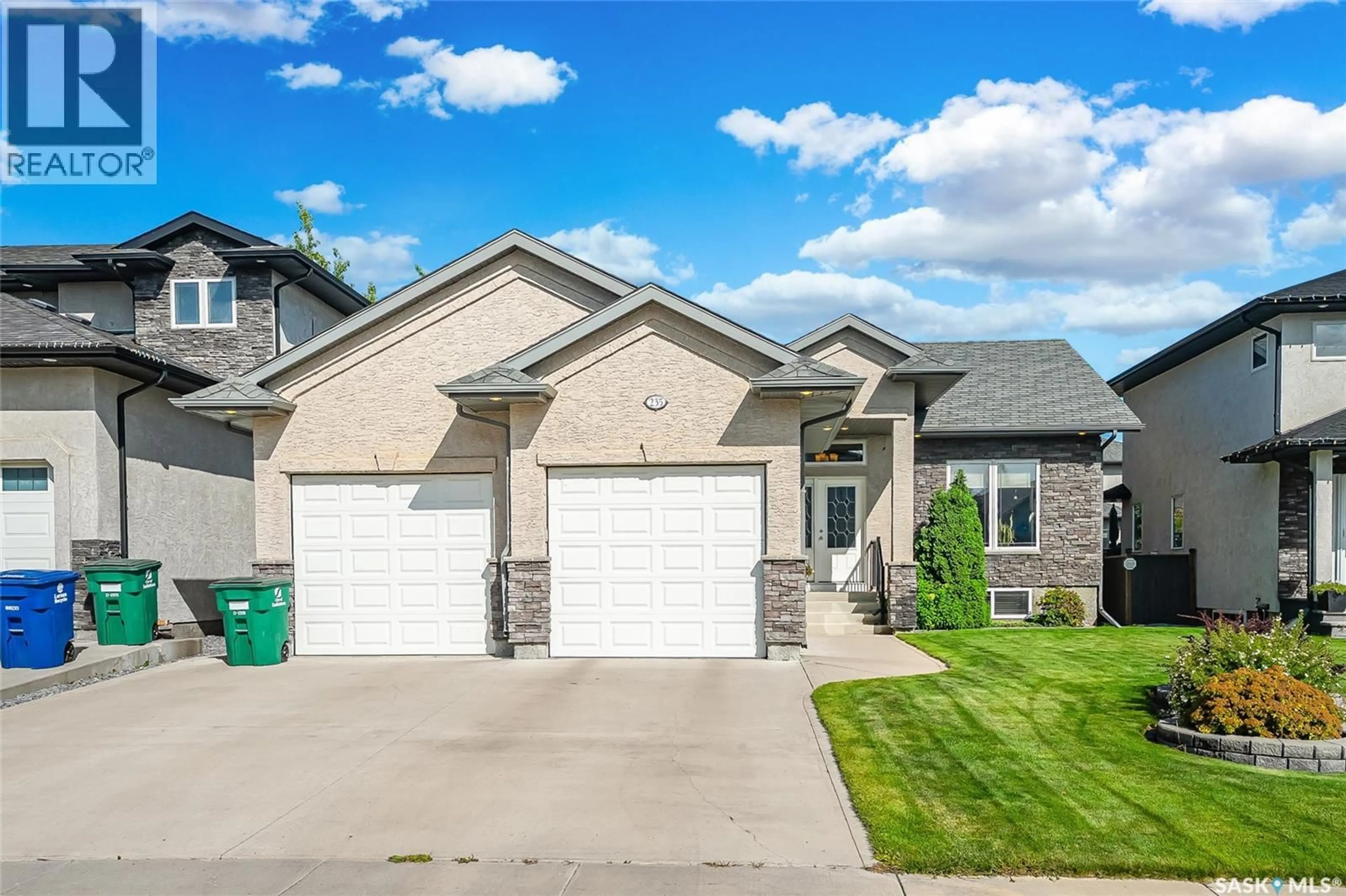 Home with brick exterior material, street for 235 WATERS LANE, Saskatoon Saskatchewan S7W0A6