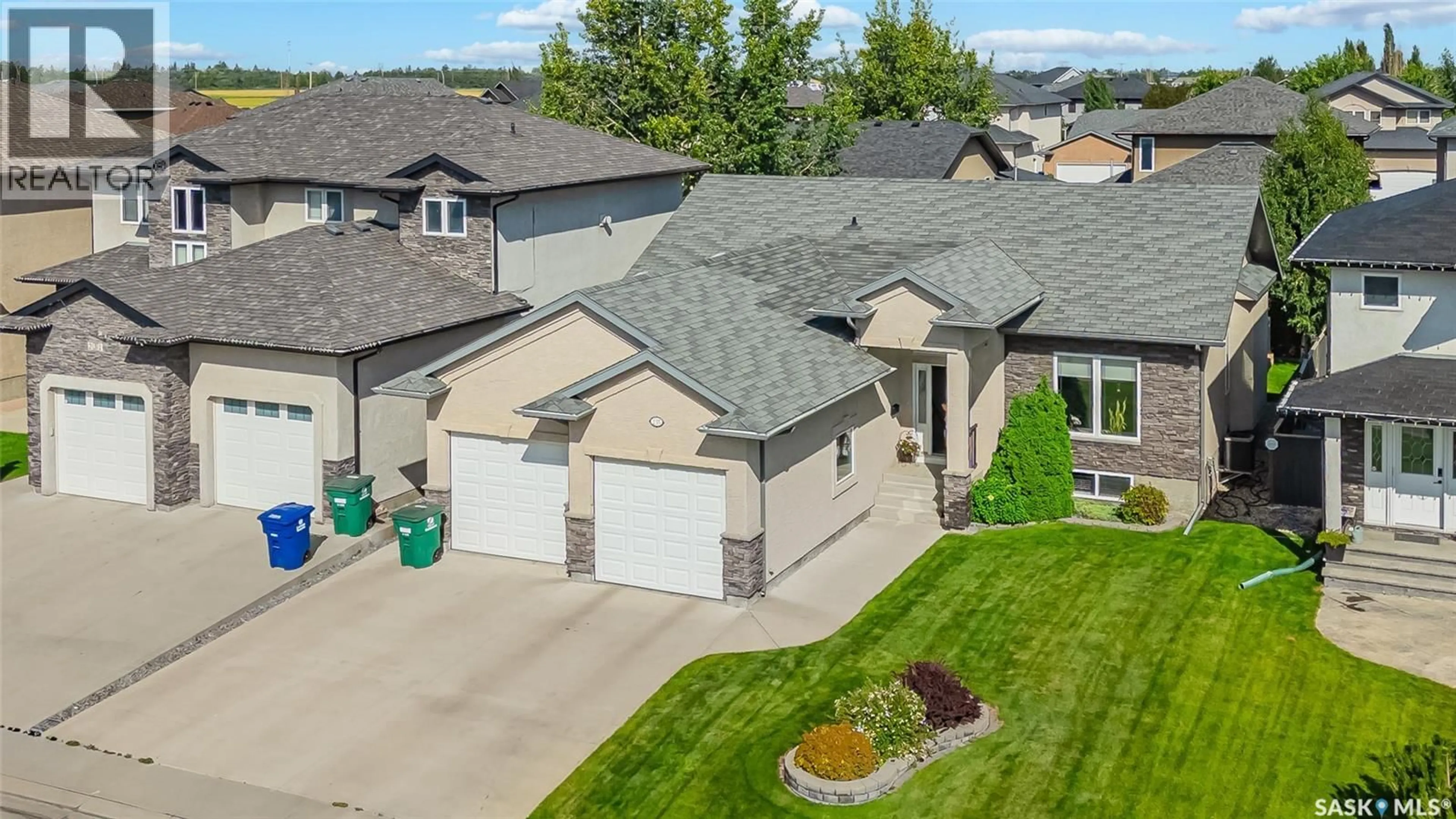 A pic from outside/outdoor area/front of a property/back of a property/a pic from drone, street for 235 WATERS LANE, Saskatoon Saskatchewan S7W0A6