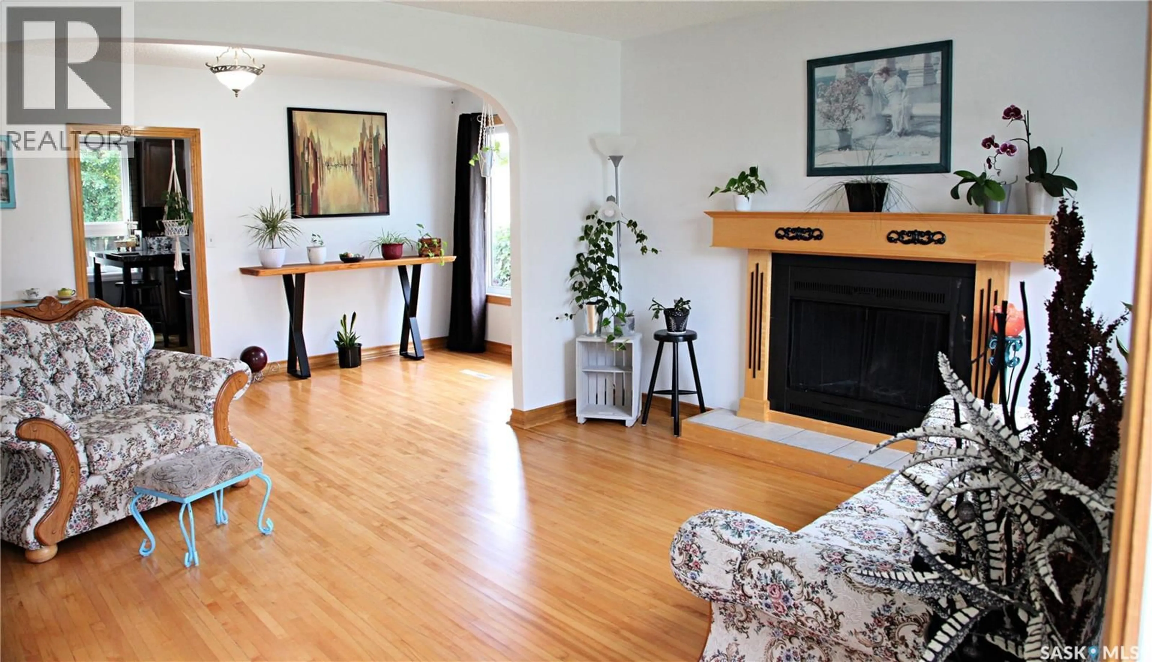 Living room with furniture, wood/laminate floor for 441 25TH STREET, Prince Albert Saskatchewan S6V1T3