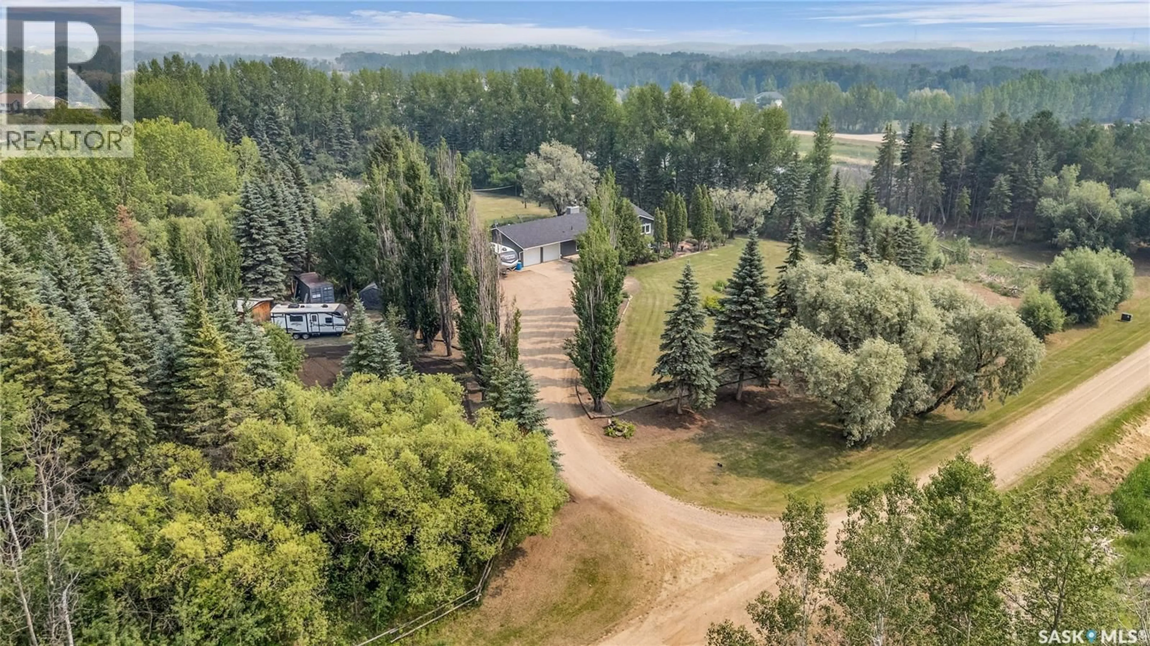 A pic from outside/outdoor area/front of a property/back of a property/a pic from drone, forest/trees view for 41 SILVER WILLOW ROAD, Prince Albert Rm No. 461 Saskatchewan S6V5P9