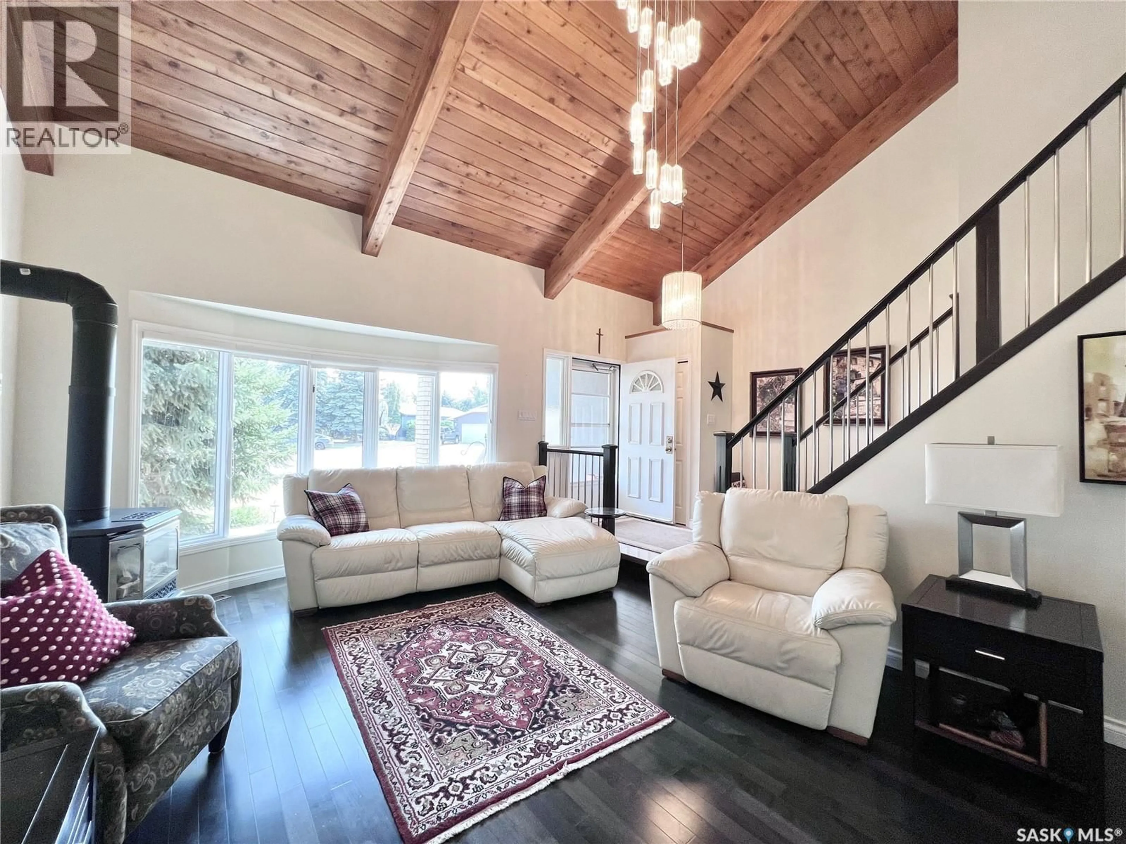Living room with furniture, wood/laminate floor for 5 POPLAR PLACE, Outlook Saskatchewan S0L2N0