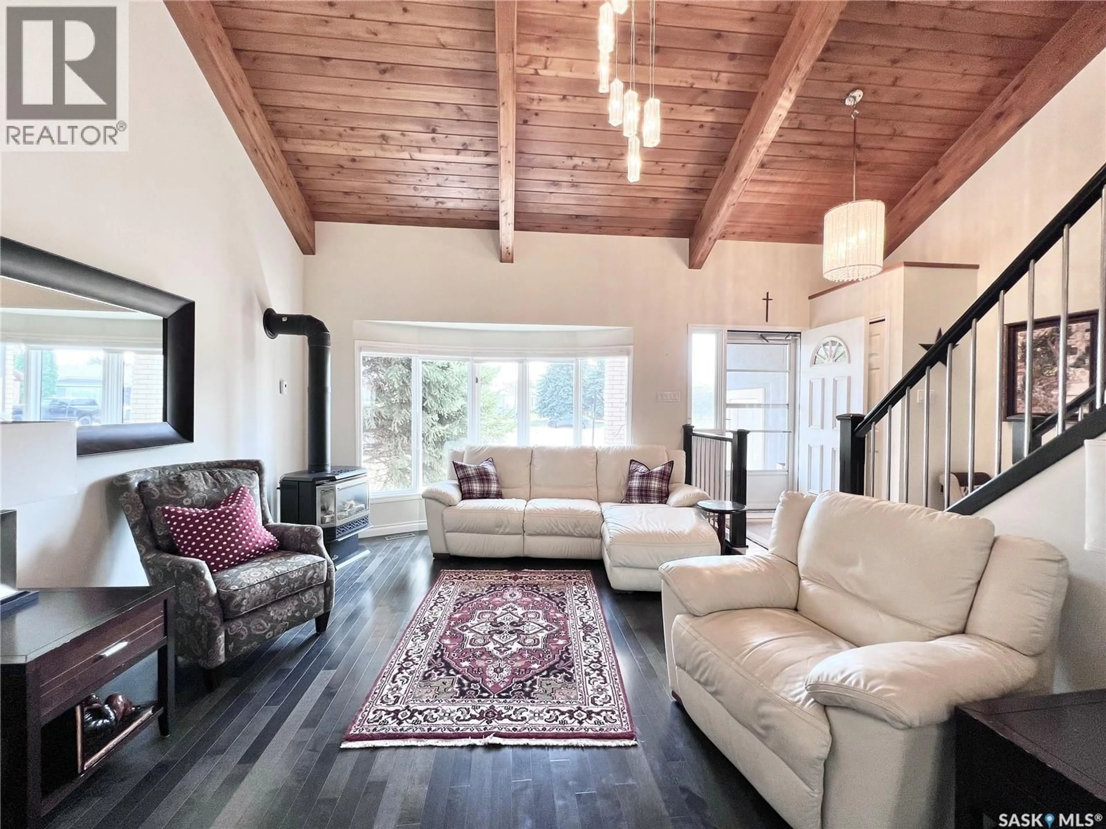 Living room with furniture, wood/laminate floor for 5 POPLAR PLACE, Outlook Saskatchewan S0L2N0