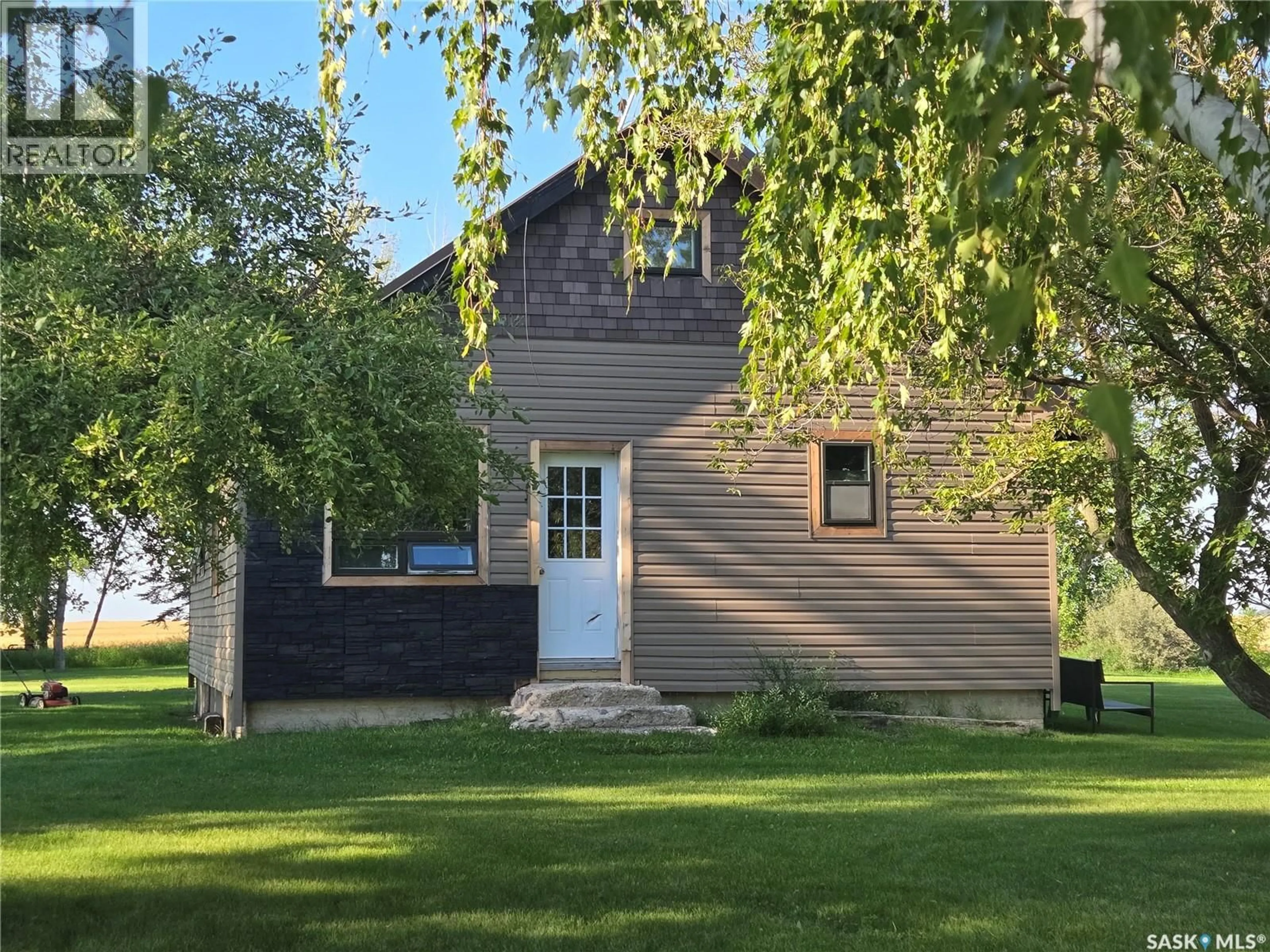 Home with vinyl exterior material, street for Spalding Rm No. 368 Saskatchewan S0K4V0