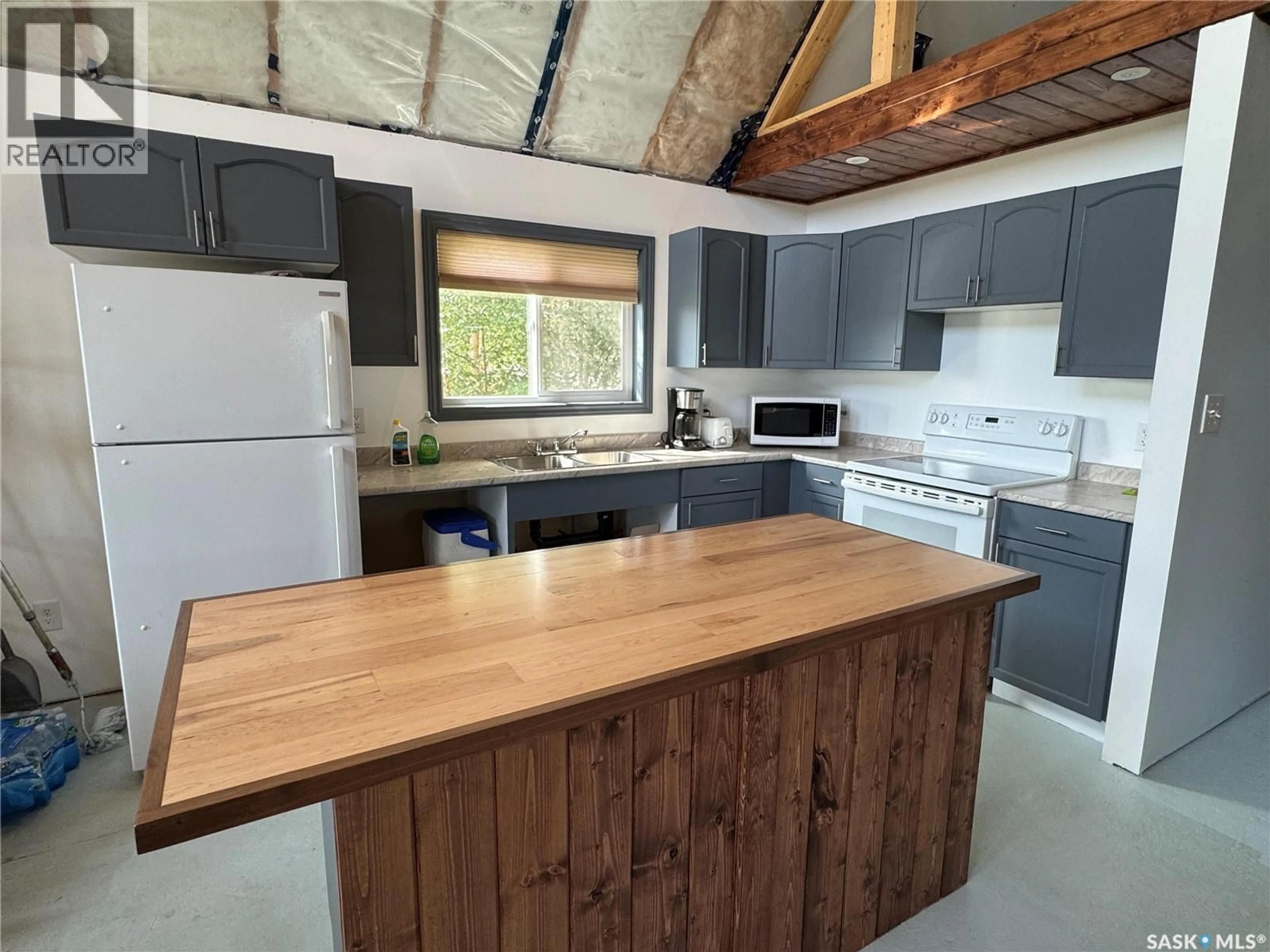 Open concept kitchen, wood/laminate floor for 120 NEMEIBEN ROAD, Northern Admin District Saskatchewan S0J1L0
