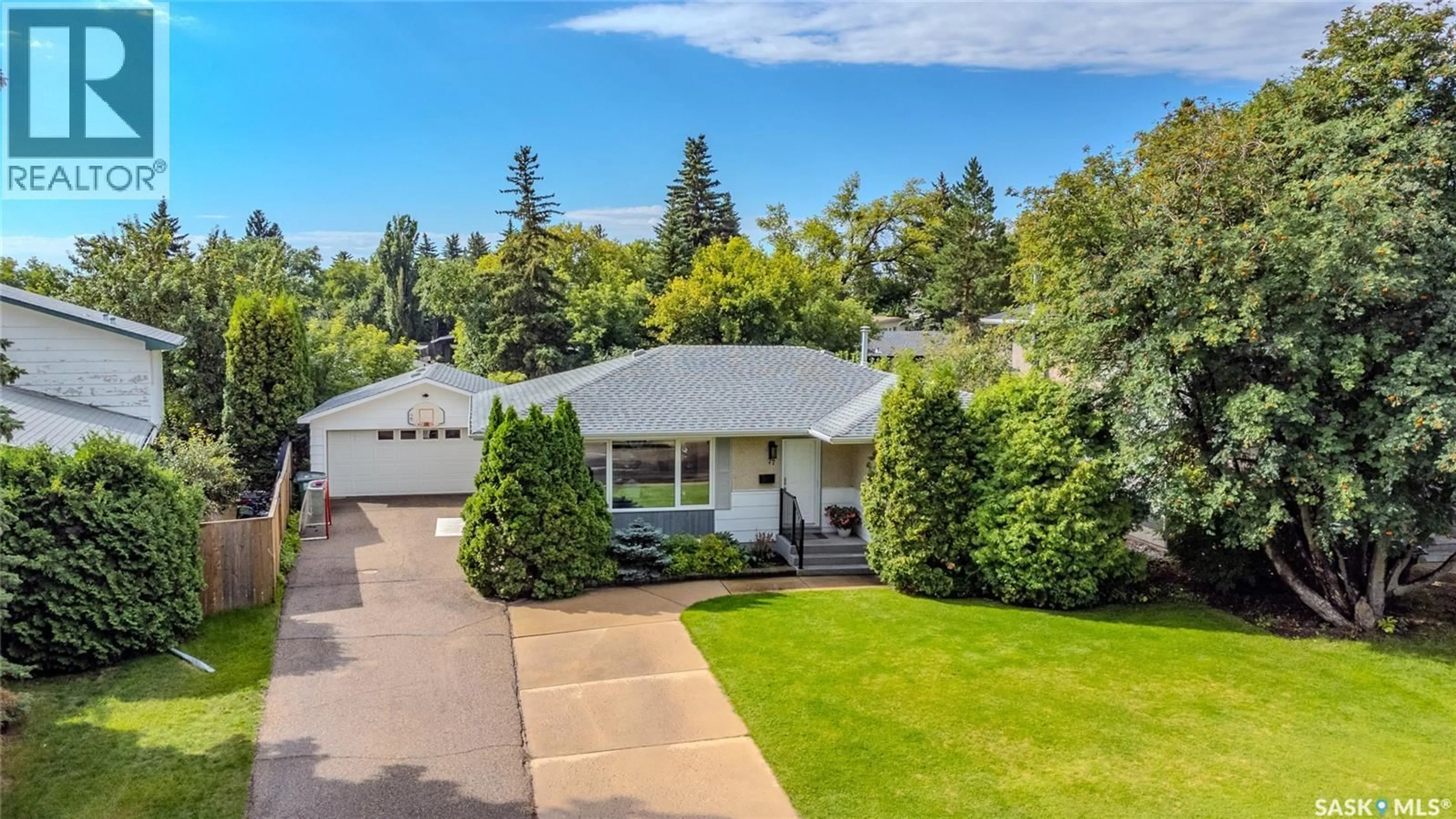 Home with vinyl exterior material, street for 77 RED RIVER ROAD, Saskatoon Saskatchewan S7K1G2