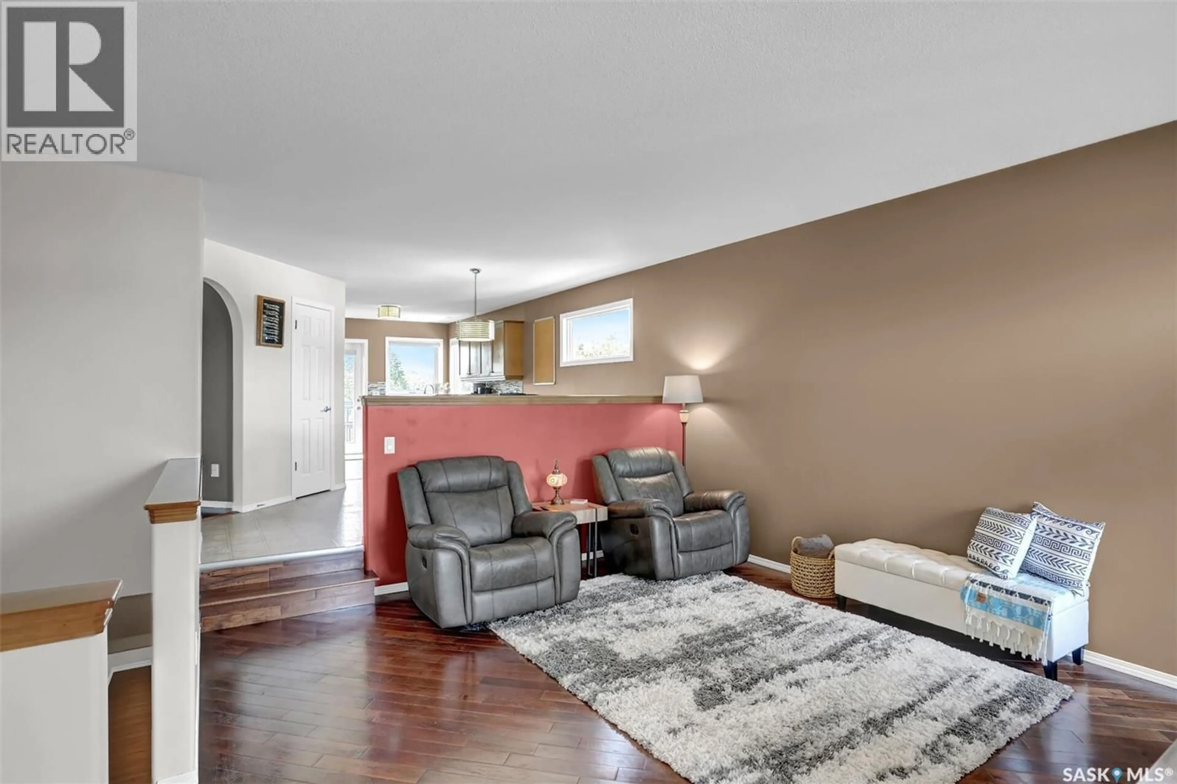 Living room with furniture, wood/laminate floor for 3428 MACLACHLAN CRESCENT, Regina Saskatchewan S4R8V1