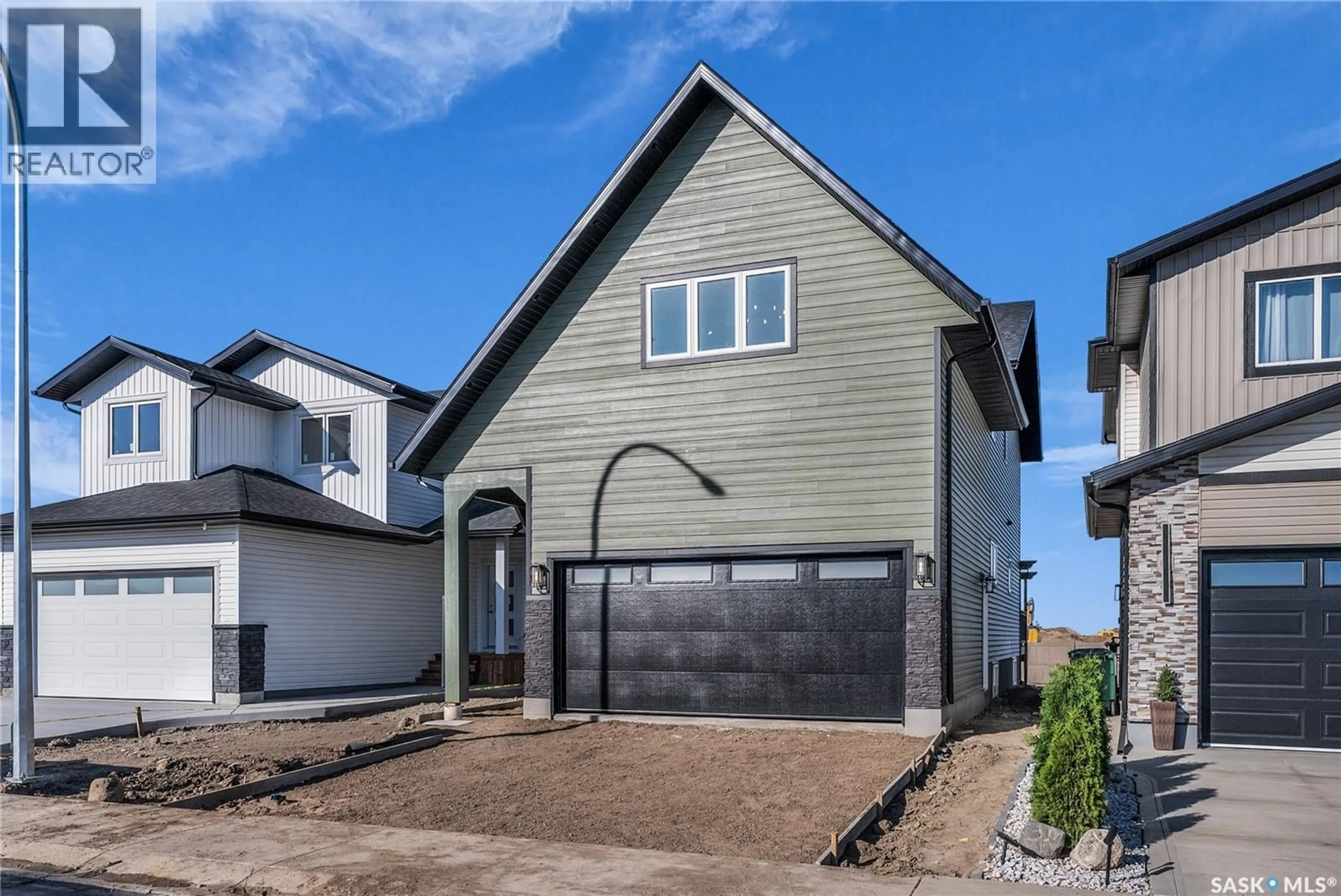 Home with vinyl exterior material, street for 307 SHARMA CRESCENT, Saskatoon Saskatchewan S7W1J1