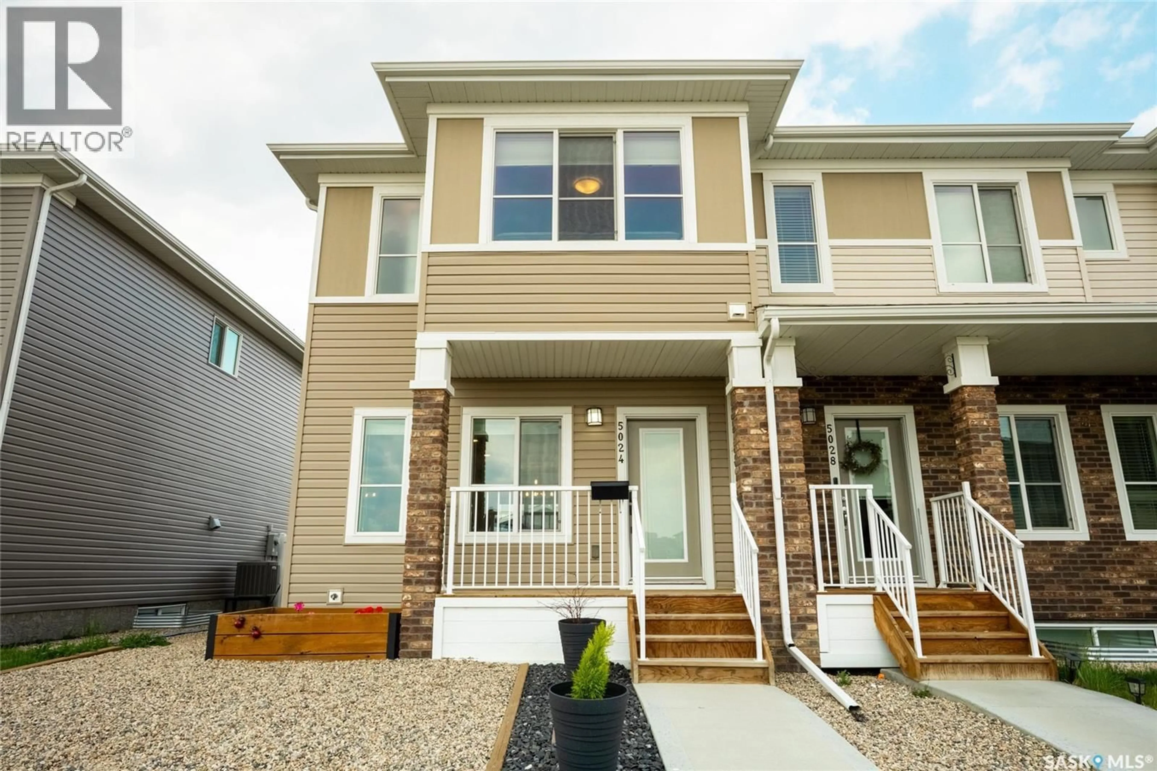 Home with vinyl exterior material, street for 5024 PRIMROSE GREEN DRIVE, Regina Saskatchewan S4V3S5