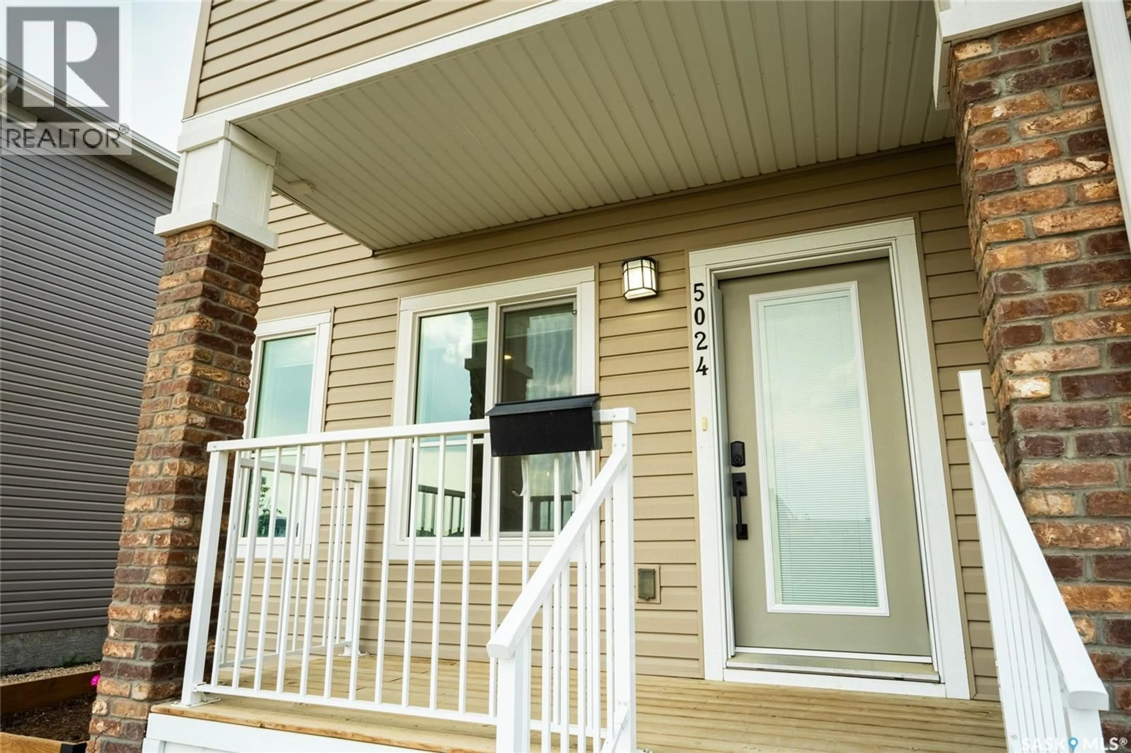 Home with vinyl exterior material, street for 5024 PRIMROSE GREEN DRIVE, Regina Saskatchewan S4V3S5