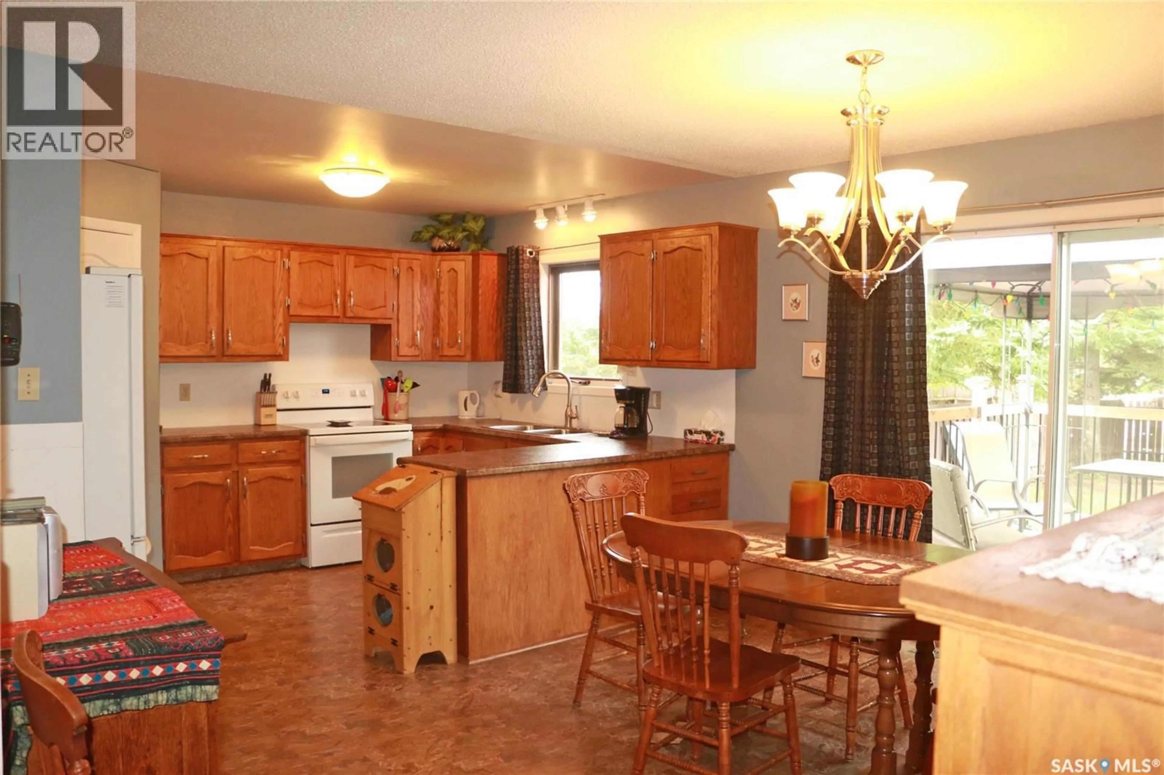 Open concept kitchen, ceramic/tile floor for 32 HOWARD CRESCENT, Lanigan Saskatchewan S0K2M0