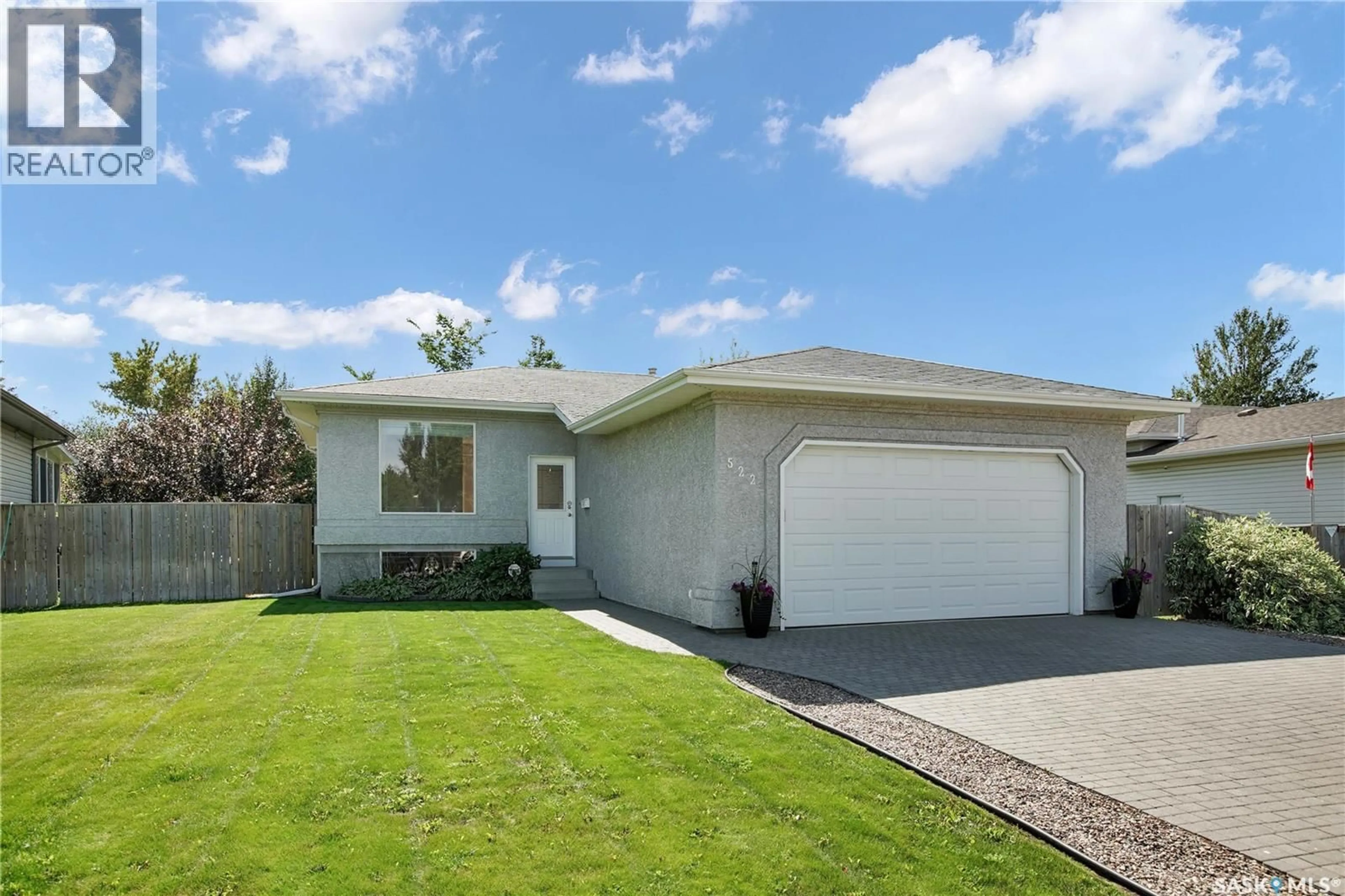 Home with vinyl exterior material, street for 522 KERR ROAD, Saskatoon Saskatchewan S7N4V3
