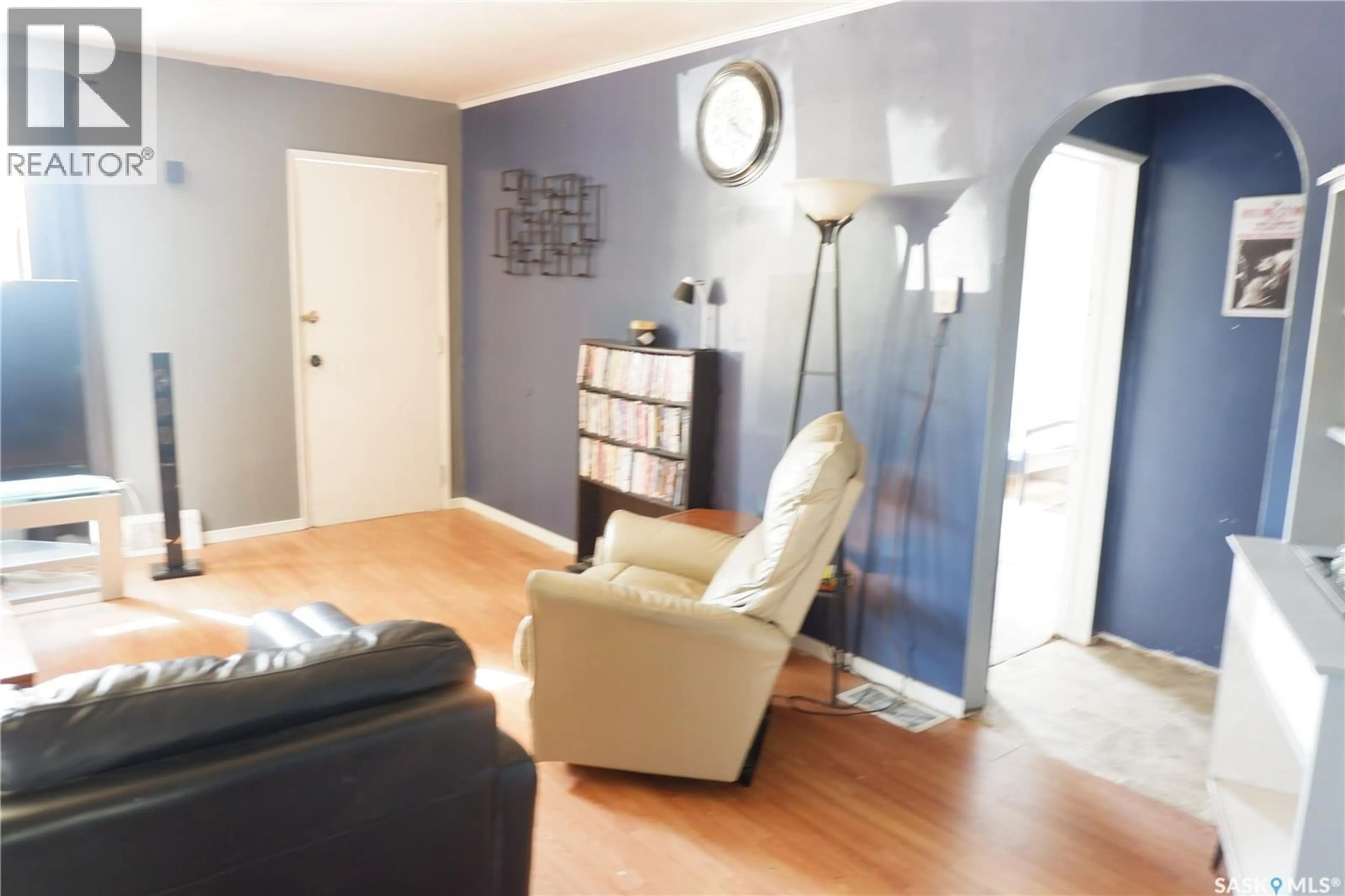 Living room with furniture, wood/laminate floor for 305 1ST STREET, Mossbank Saskatchewan S0H3G0