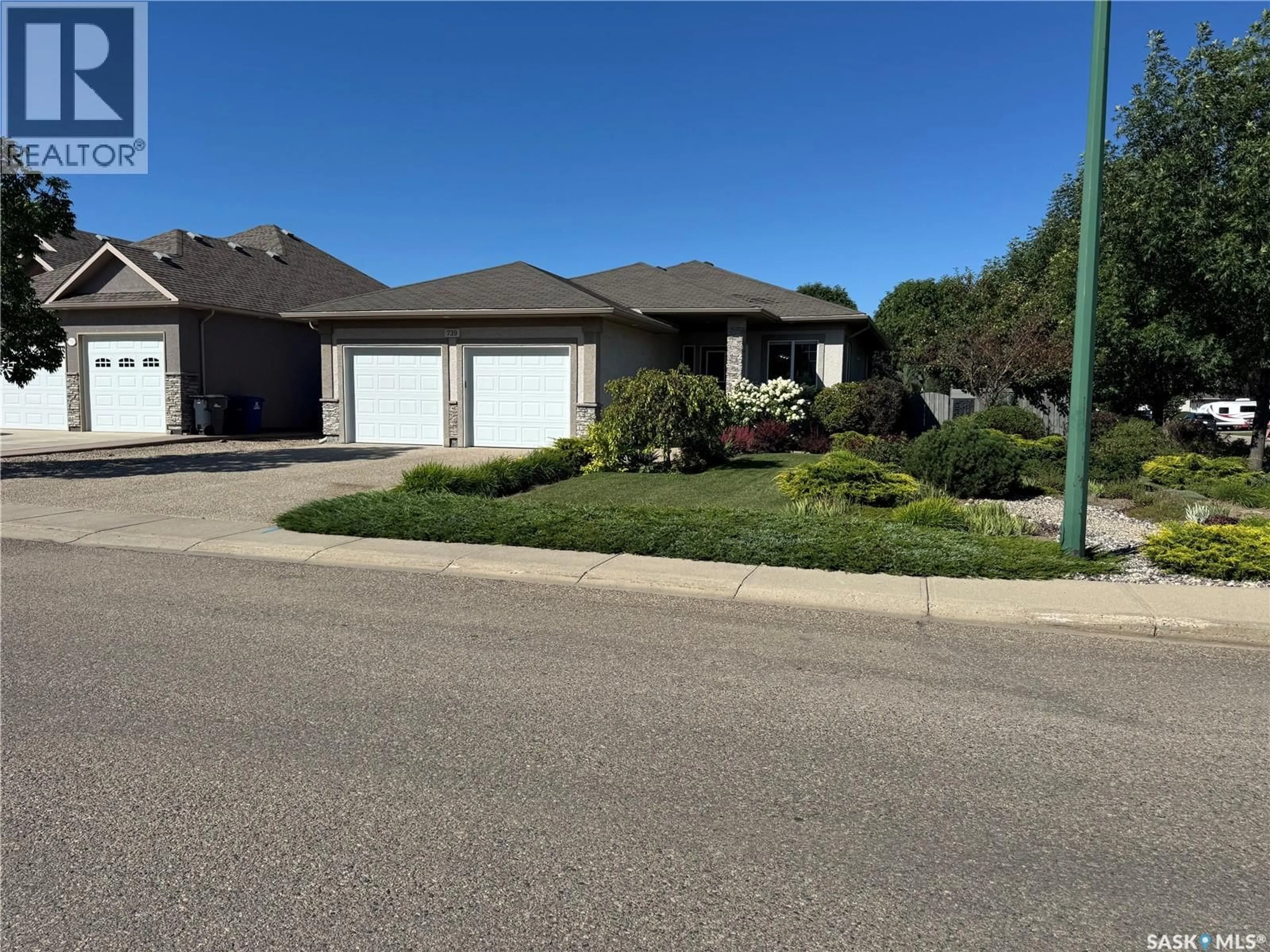A pic from outside/outdoor area/front of a property/back of a property/a pic from drone, street for 739 18TH STREET, Weyburn Saskatchewan S4H3M2