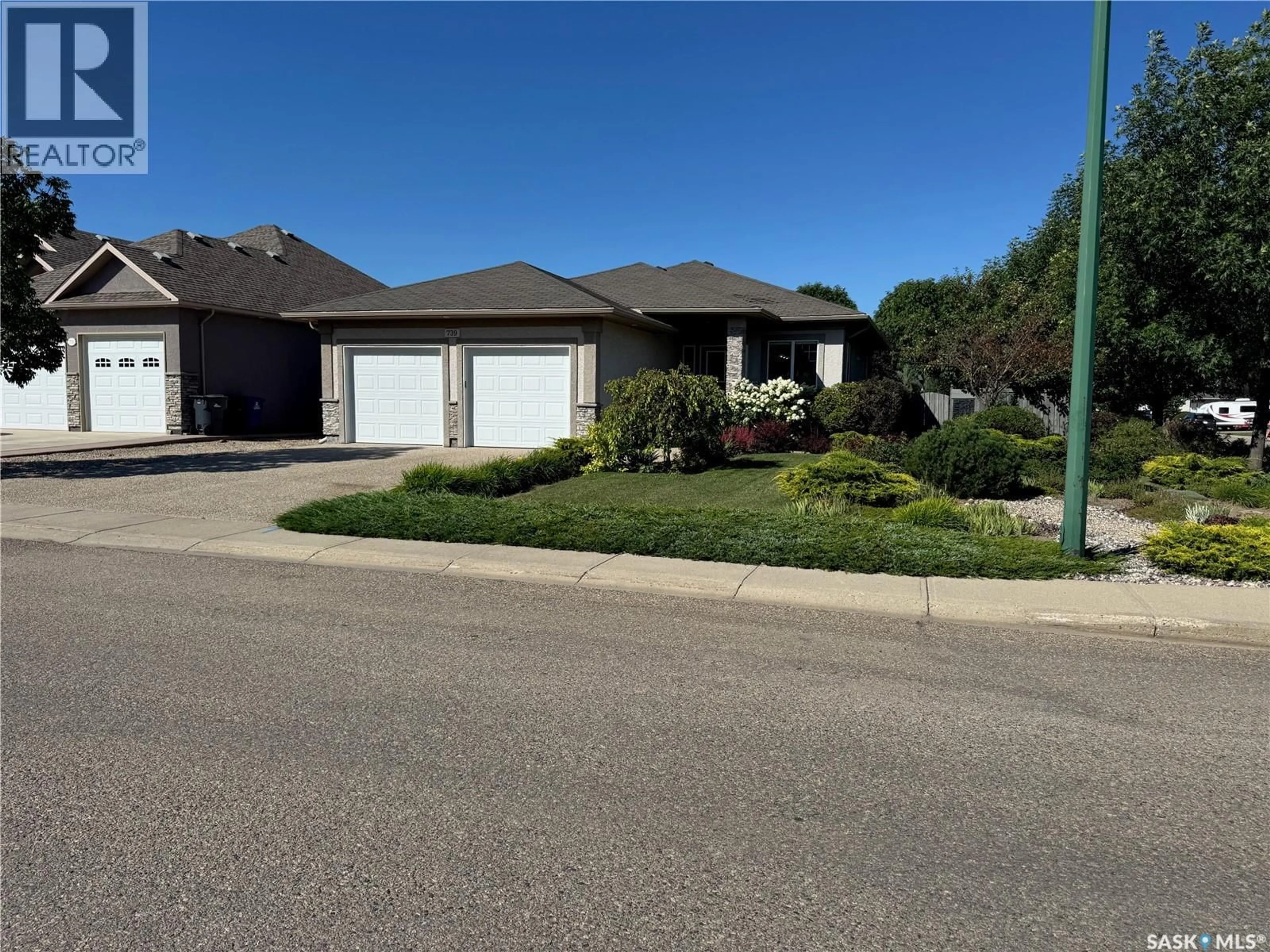 A pic from outside/outdoor area/front of a property/back of a property/a pic from drone, street for 739 18TH STREET, Weyburn Saskatchewan S4H3M2