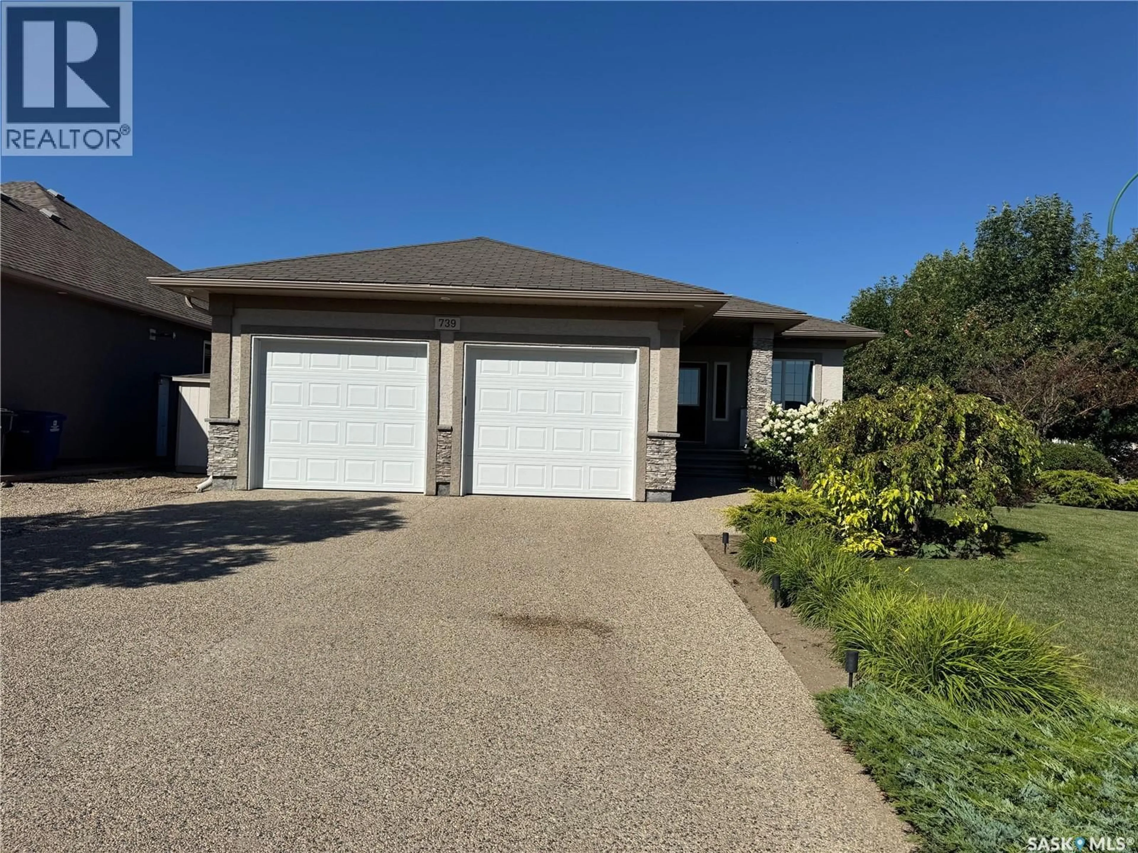 A pic from outside/outdoor area/front of a property/back of a property/a pic from drone, street for 739 18TH STREET, Weyburn Saskatchewan S4H3M2