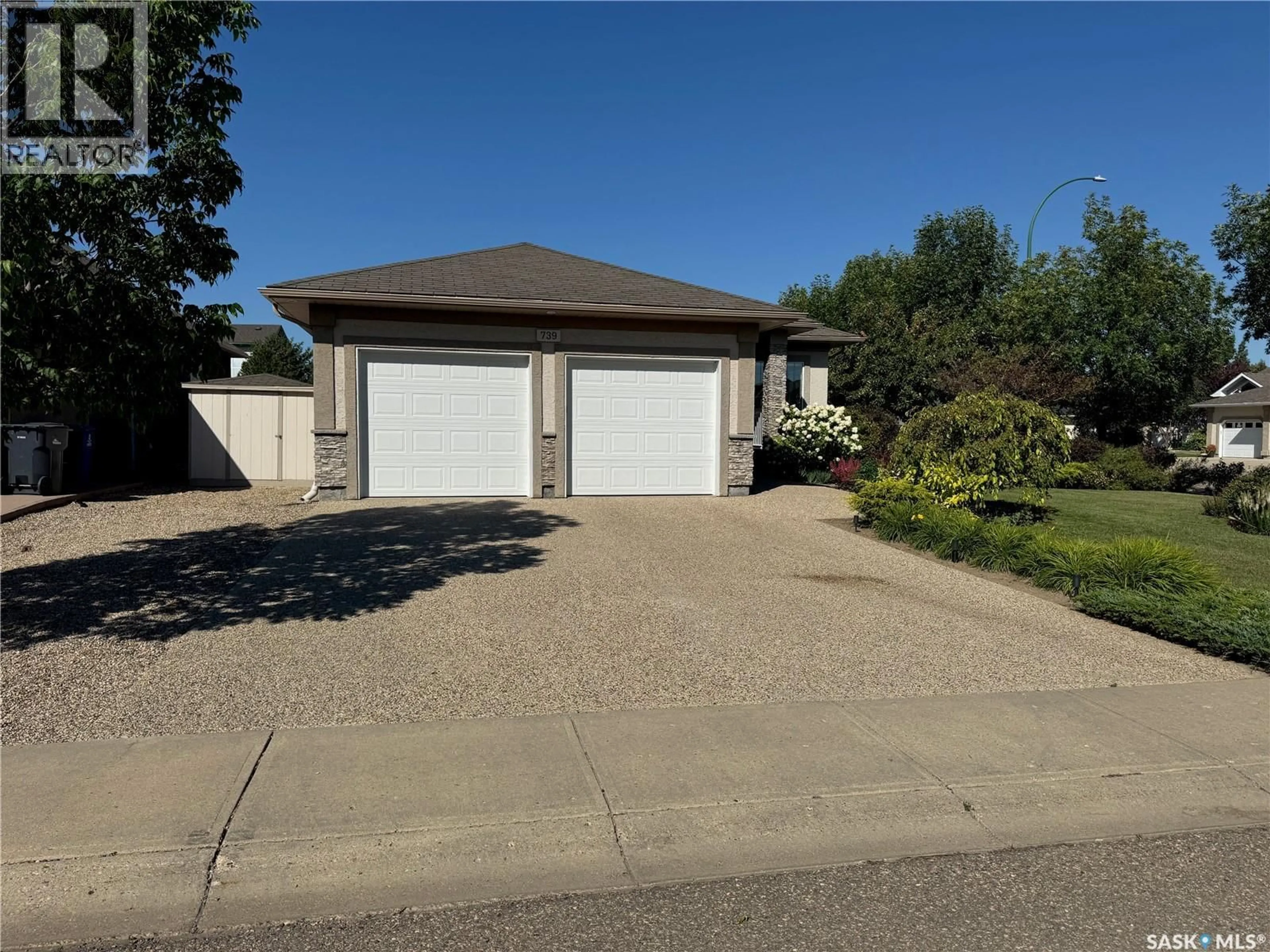A pic from outside/outdoor area/front of a property/back of a property/a pic from drone, street for 739 18TH STREET, Weyburn Saskatchewan S4H3M2