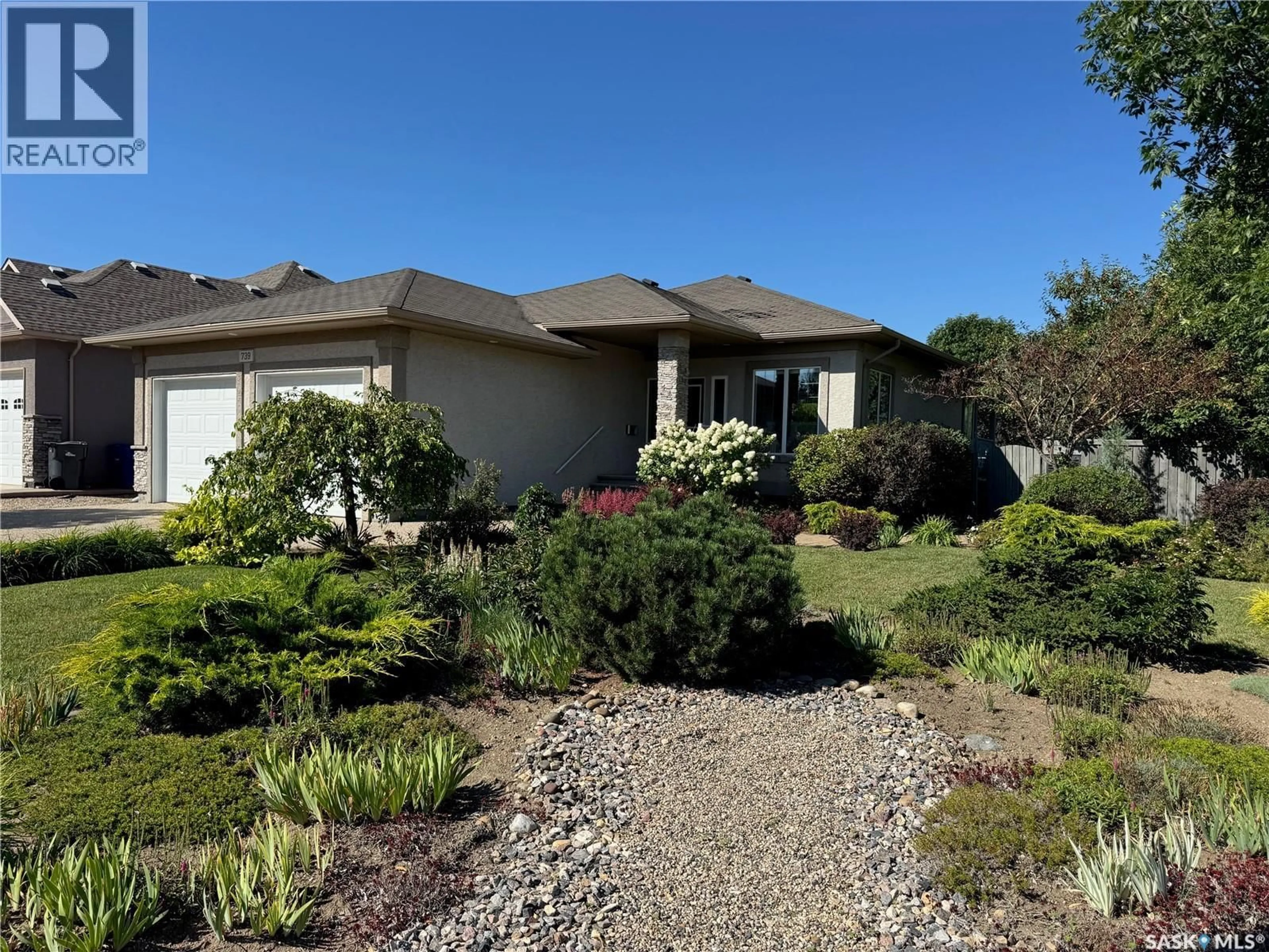 A pic from outside/outdoor area/front of a property/back of a property/a pic from drone, street for 739 18TH STREET, Weyburn Saskatchewan S4H3M2