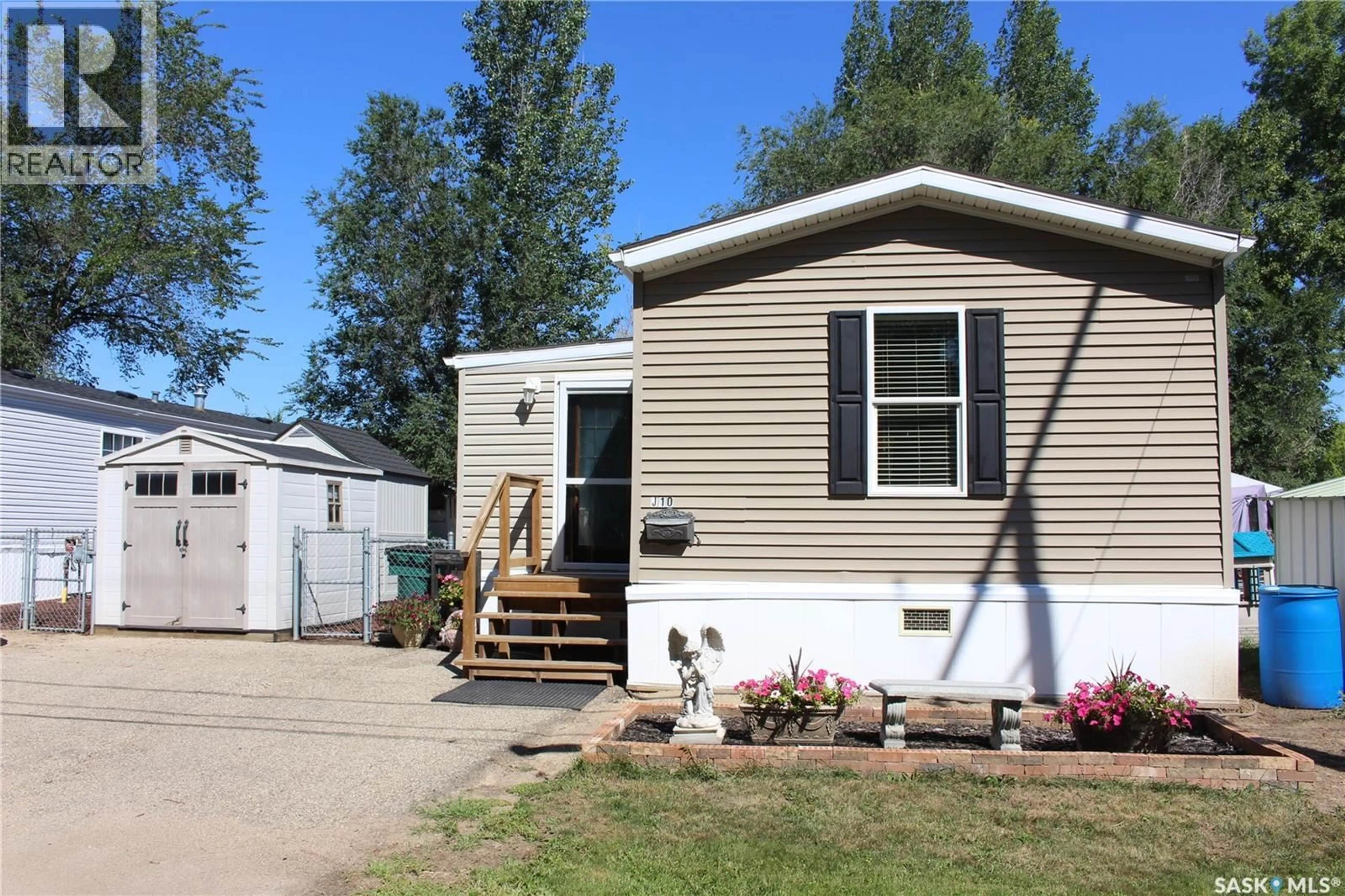 Home with vinyl exterior material, street for J10 - 1295 9TH AVENUE, Moose Jaw Saskatchewan S6J1C5