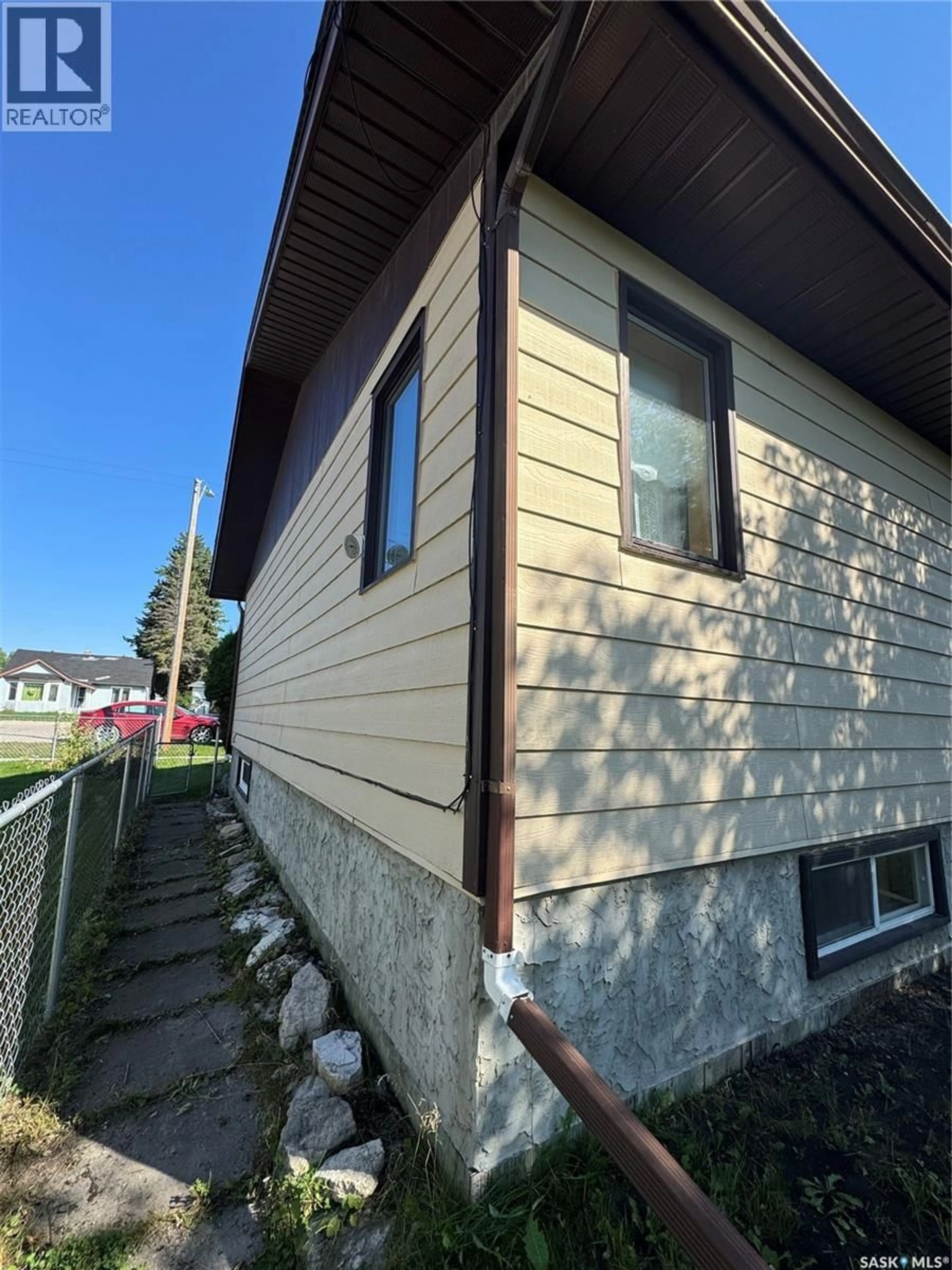 Home with vinyl exterior material, street for 403 CHURCHILL STREET, Hudson Bay Saskatchewan S0E0Y0