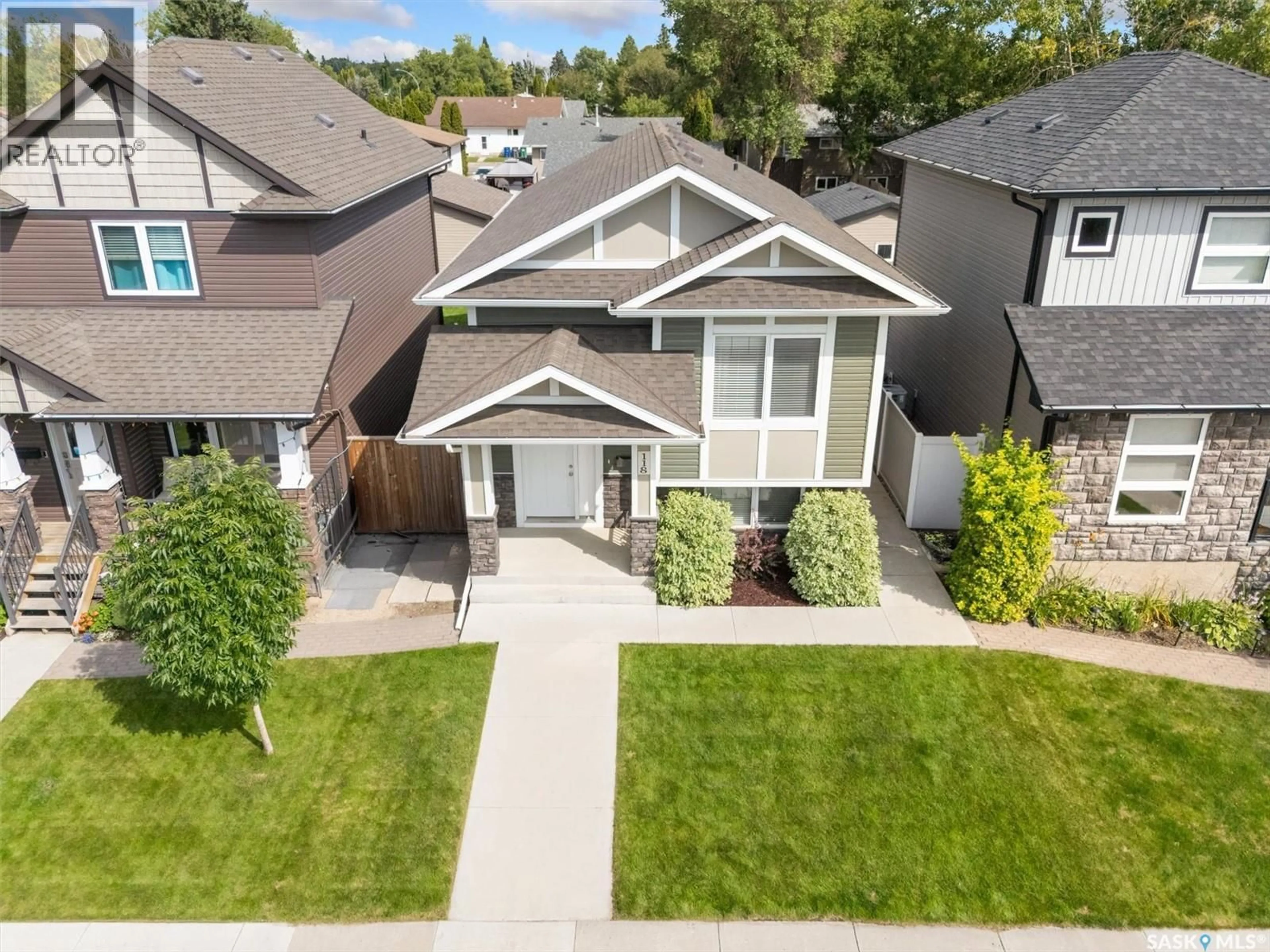 A pic from outside/outdoor area/front of a property/back of a property/a pic from drone, street for 118 CHILDERS CRESCENT, Saskatoon Saskatchewan S7L3G4