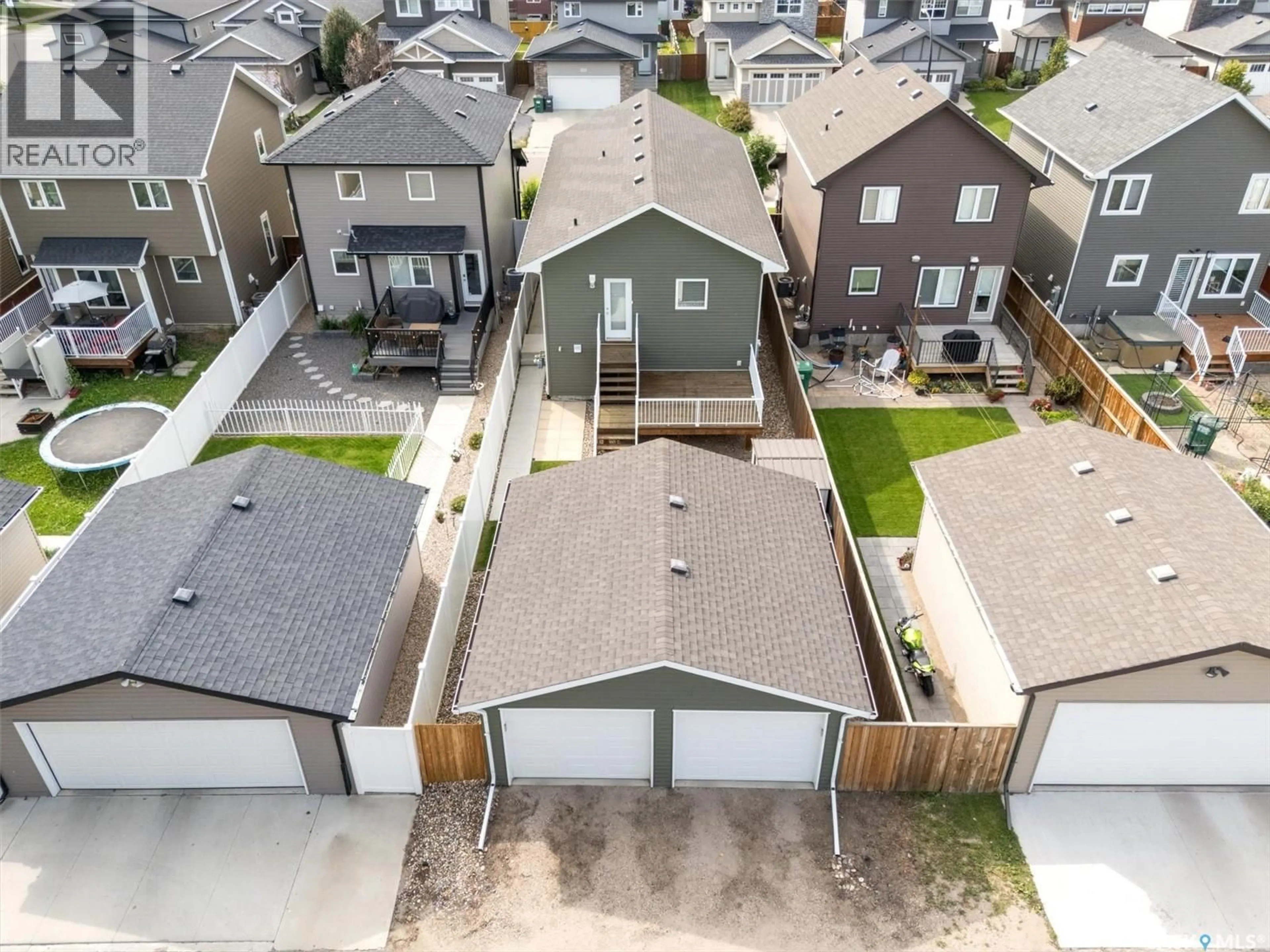 A pic from outside/outdoor area/front of a property/back of a property/a pic from drone, street for 118 CHILDERS CRESCENT, Saskatoon Saskatchewan S7L3G4