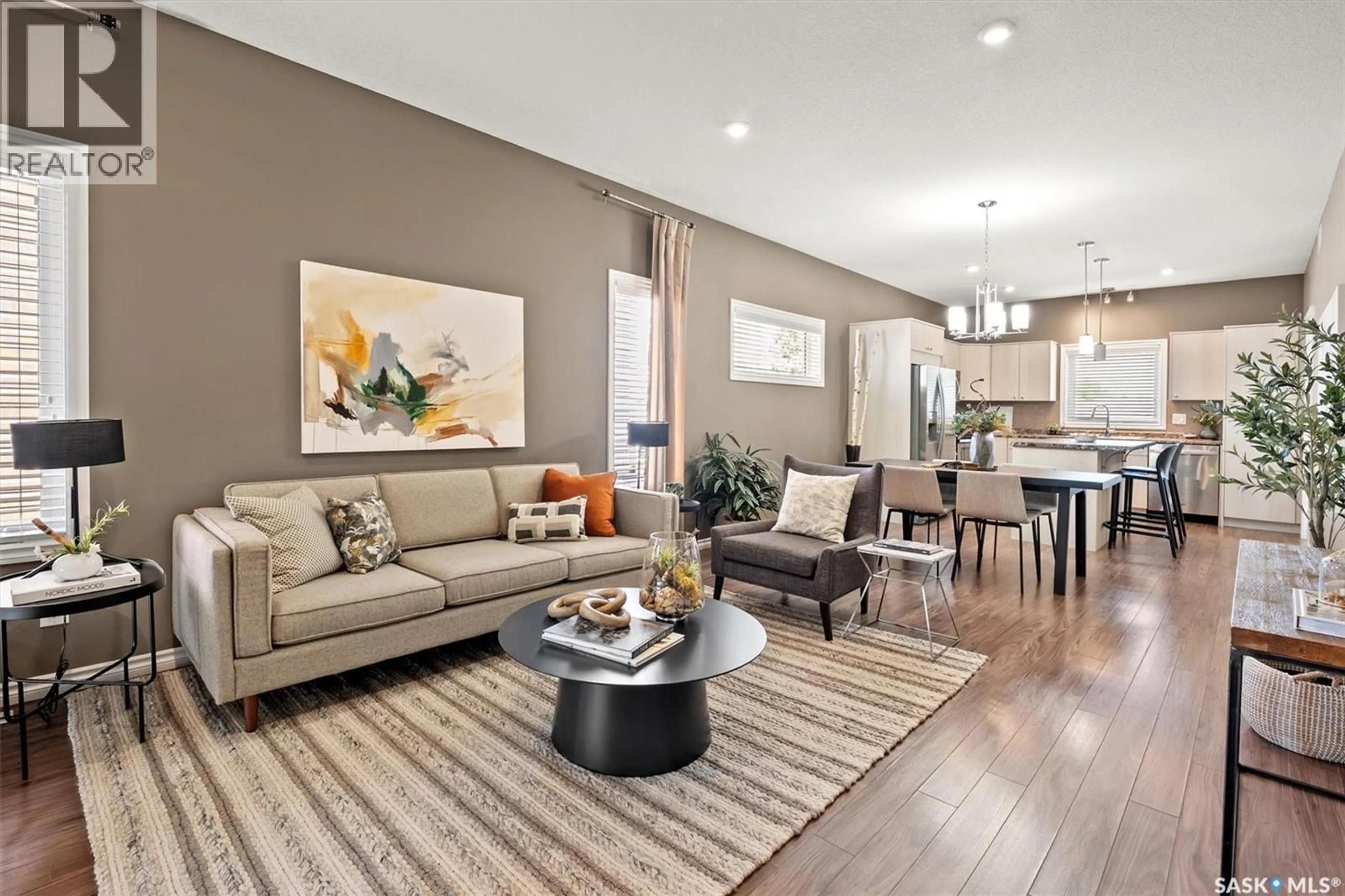 Living room with furniture, wood/laminate floor for 118 CHILDERS CRESCENT, Saskatoon Saskatchewan S7L3G4