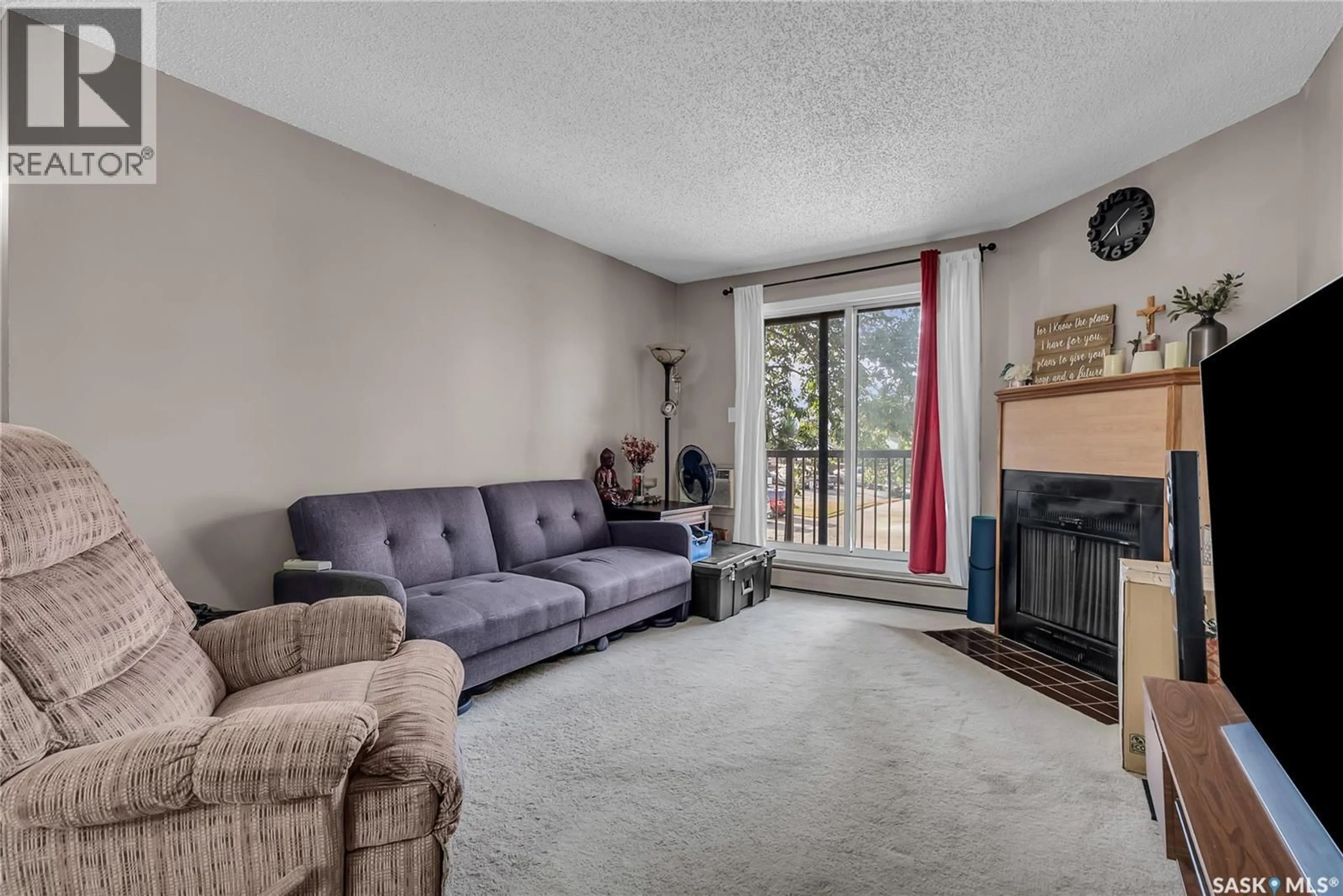 Living room with furniture, carpet floor for 215 - 3308 33RD STREET, Saskatoon Saskatchewan S7L6S6